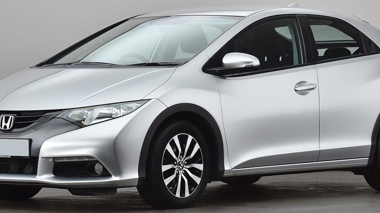 2013 Honda Civic — silver hatchback, front three-quarter view