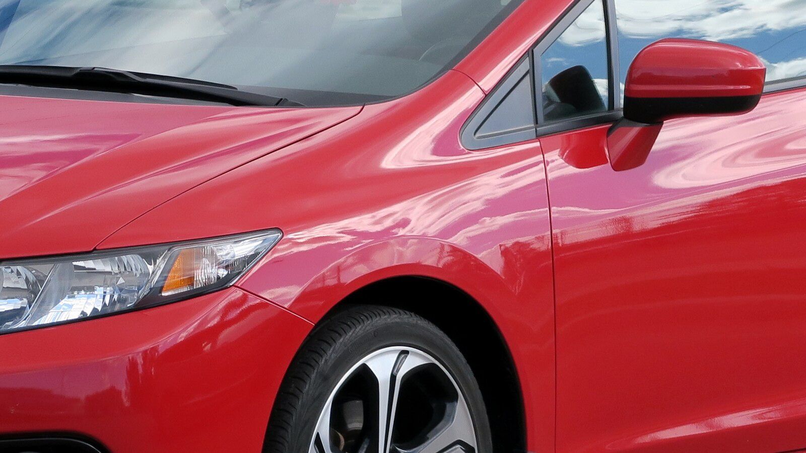 2014 Honda Civic — red Si sedan, front three-quarter view