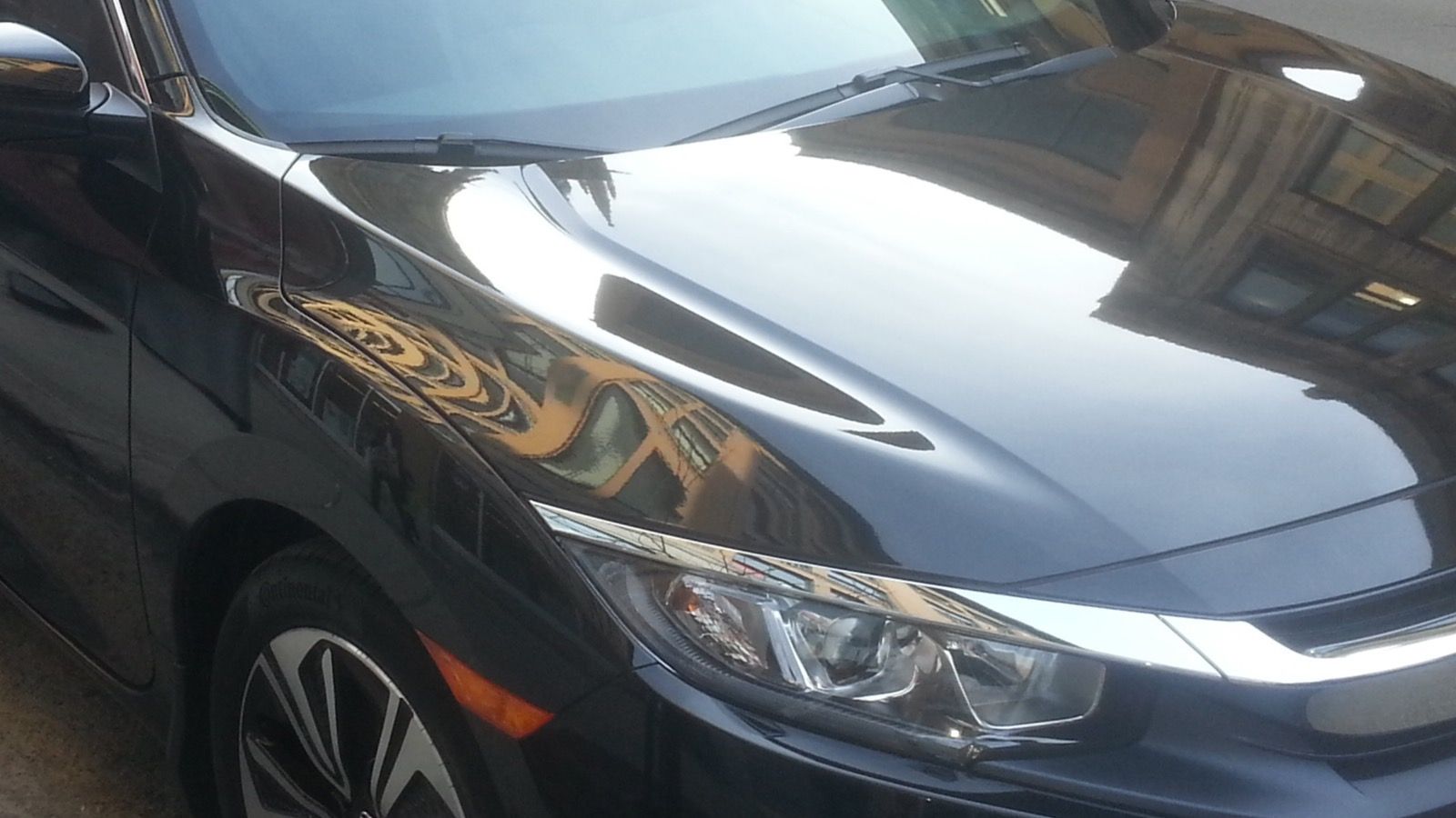 2016 Honda Civic — silver coupe, front three-quarter view