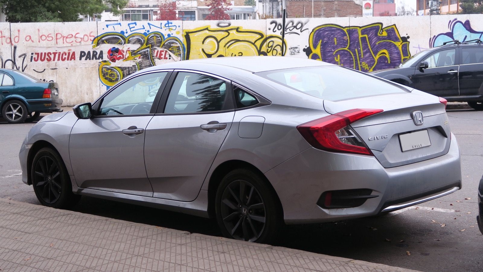 2021 Honda Civic — silver 2.0 EX sedan, rear three-quarter view