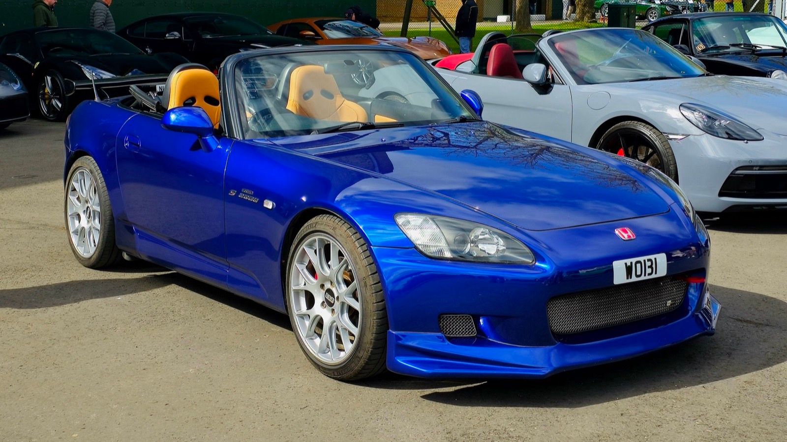 Blue 2001 Honda S2000 roadster with top down, front three-quarter view