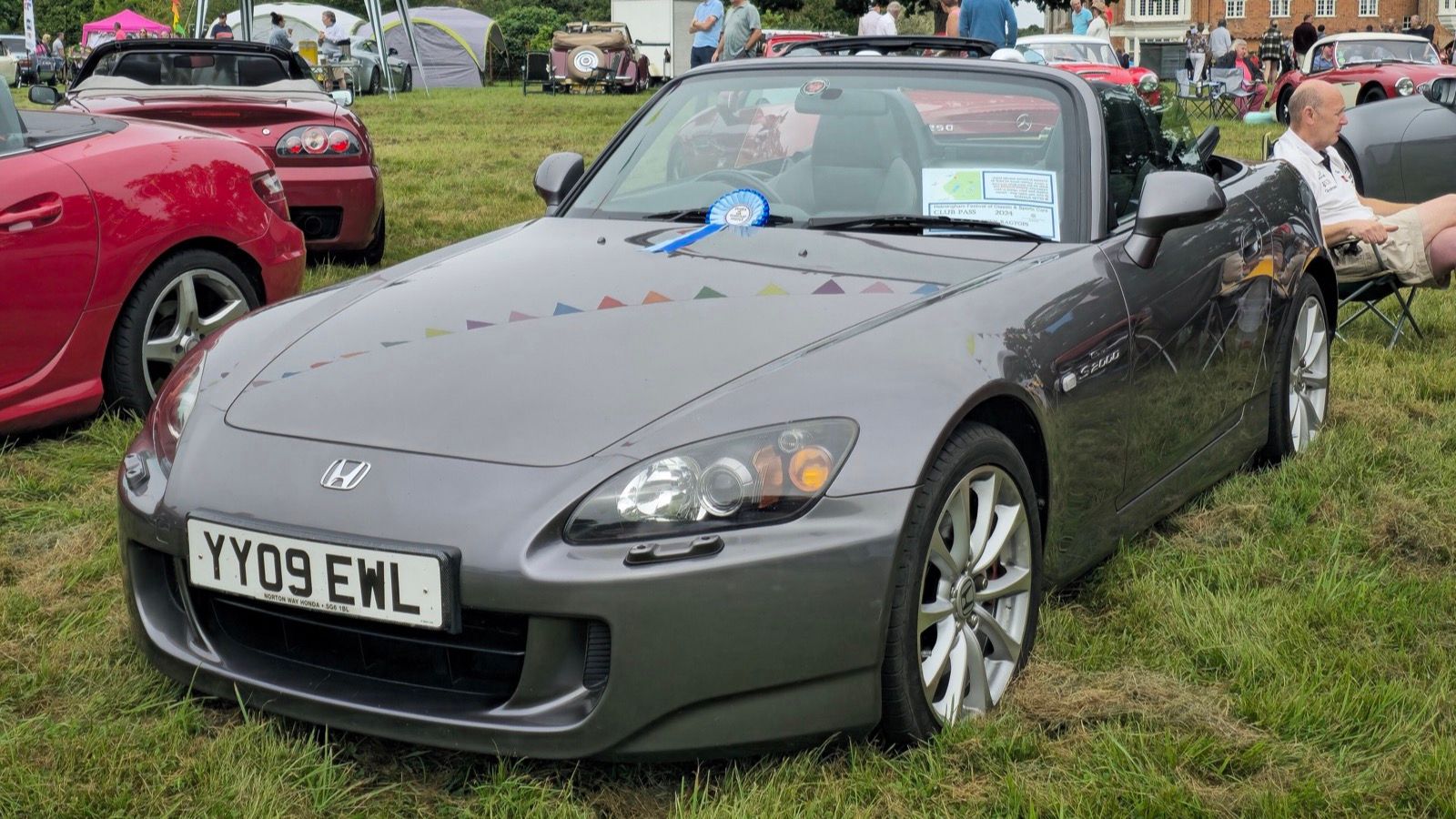 Grey 2009 Honda S2000 roadster at a car show, front three-quarter view
