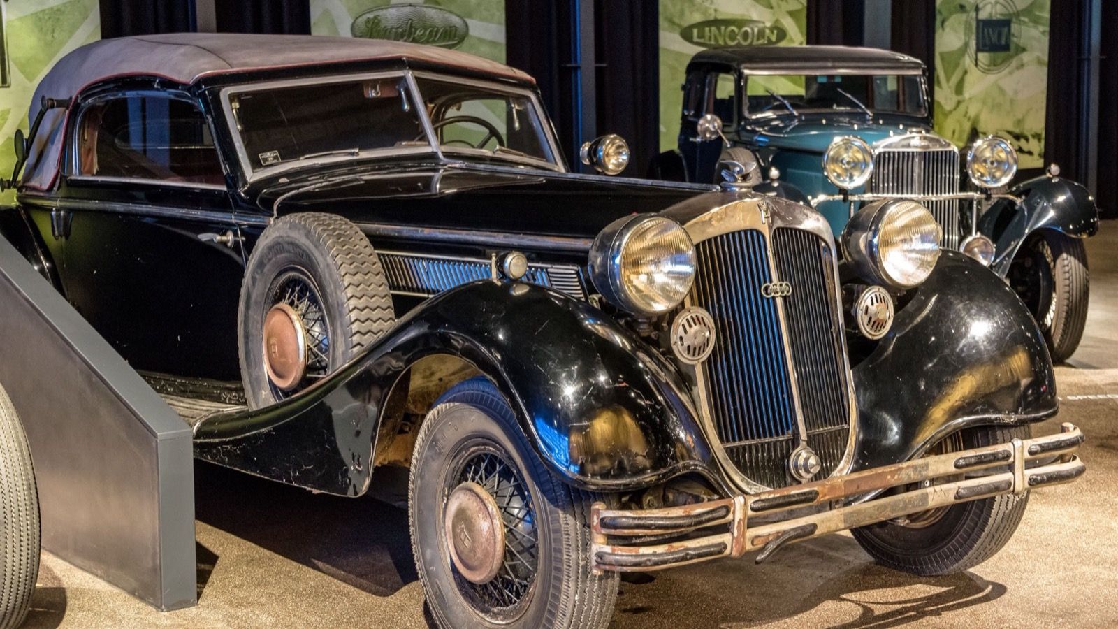 Black unrestored 1937 Horch 853 Sport cabriolet in a museum, front three-quarter view