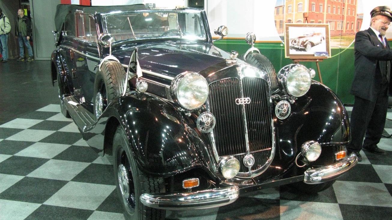 Black 1940 Horch 951 A sedan cabriolet at an indoor classic car show, front three-quarter view