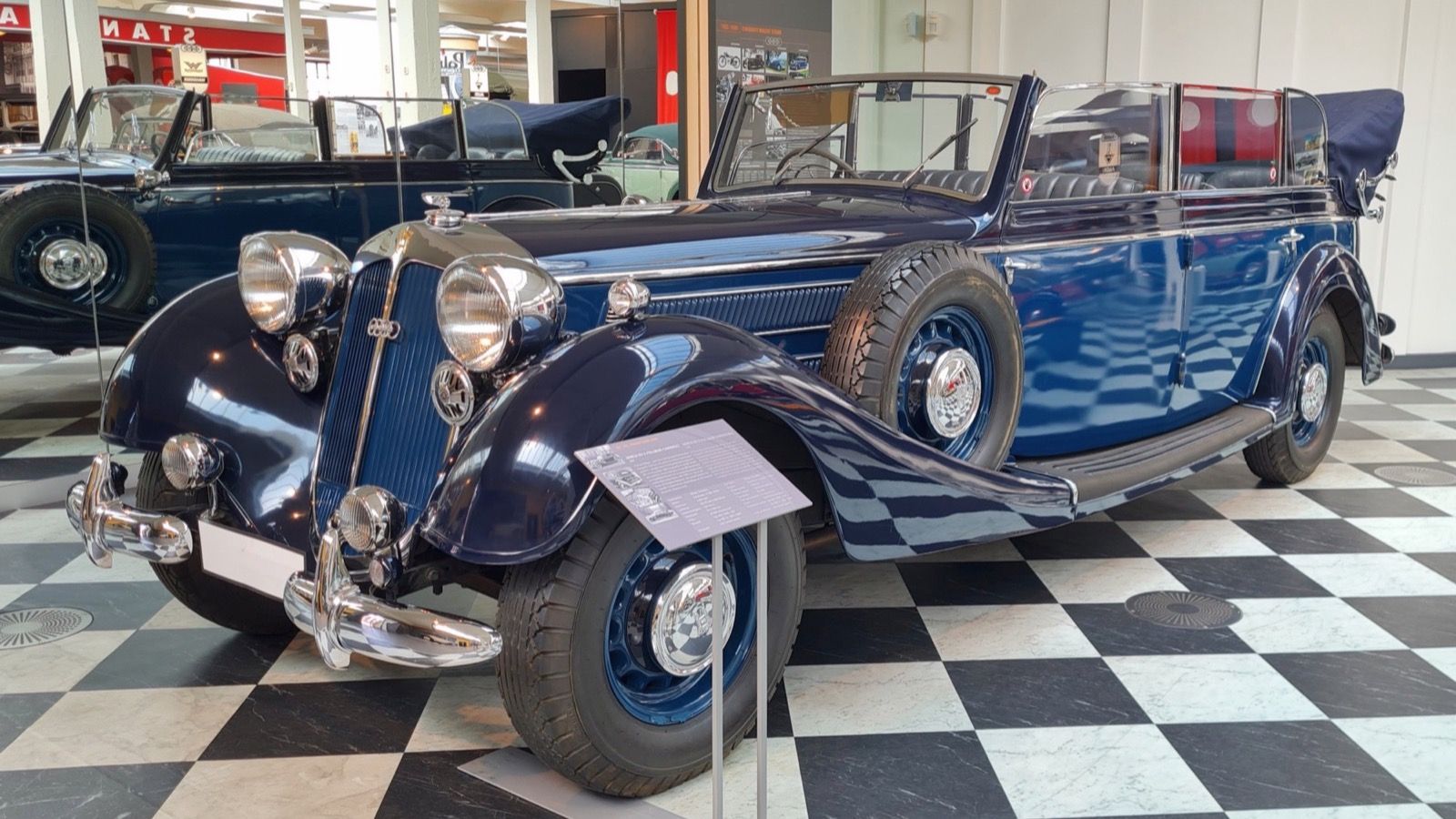 Dark blue Horch 951 A Pullman cabriolet on museum display, front three-quarter view