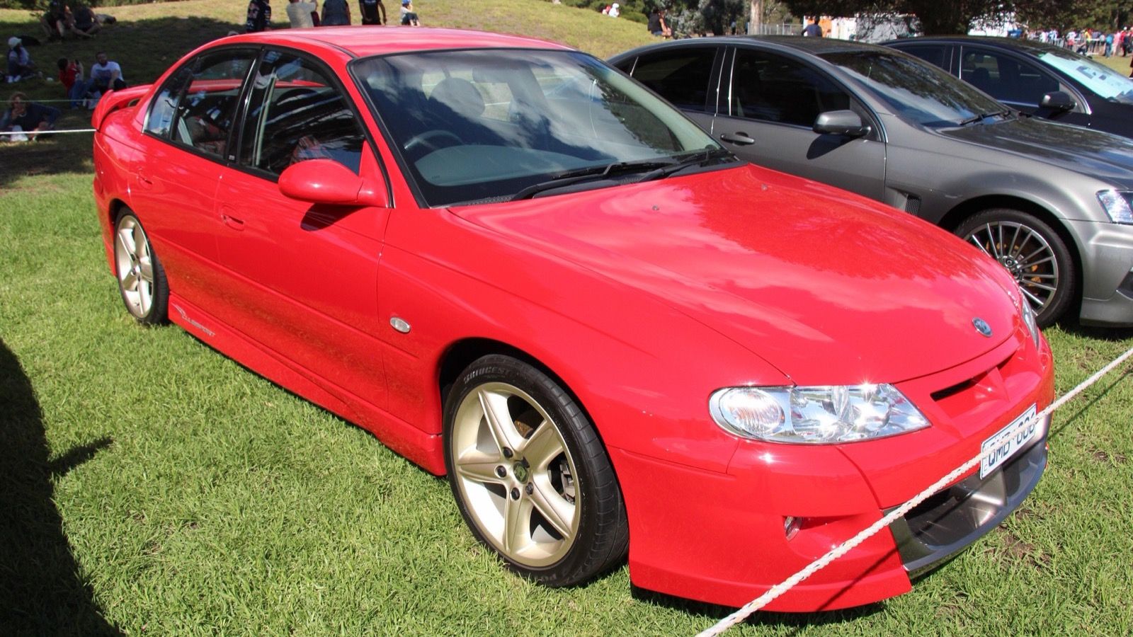 Red 2000 Holden VX HSV ClubSport sedan, front three-quarter view