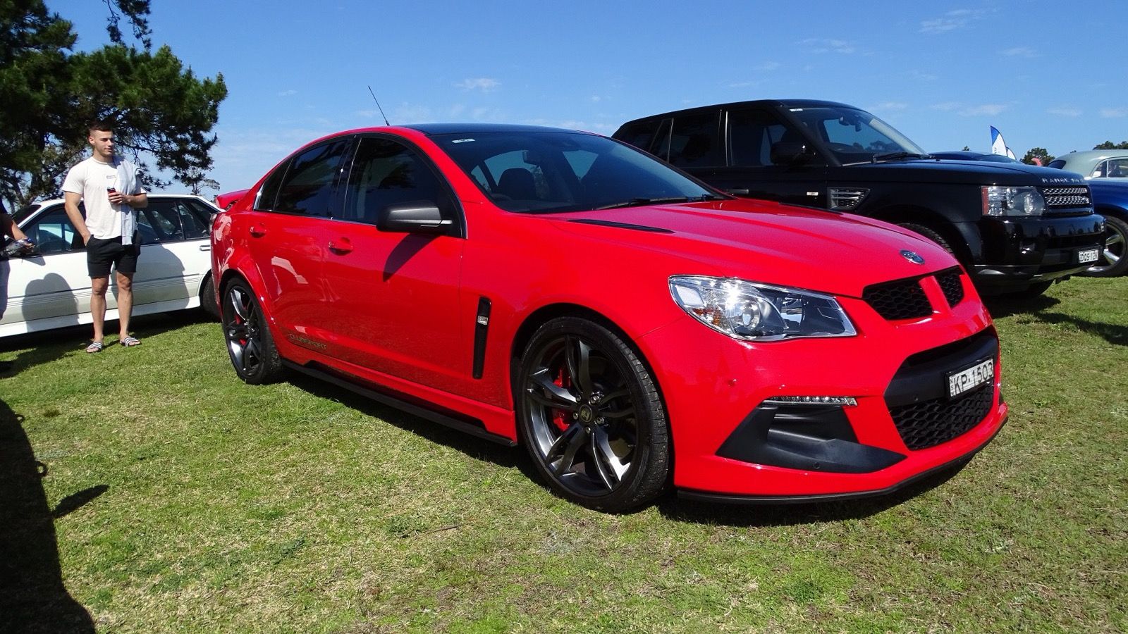Red HSV VF ClubSport R8 sedan, front three-quarter view