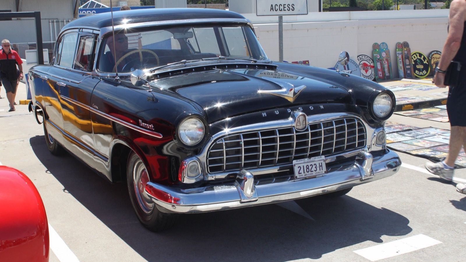 Black 1955 Hudson Hornet Custom four-door sedan on the Nash body, front three-quarter view