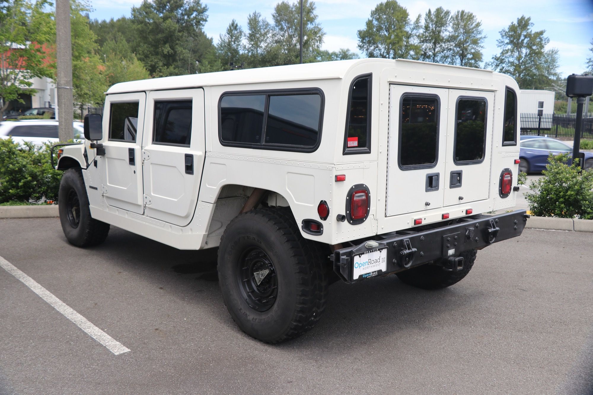 White 1995 AM General Hummer H1, rear three-quarter view