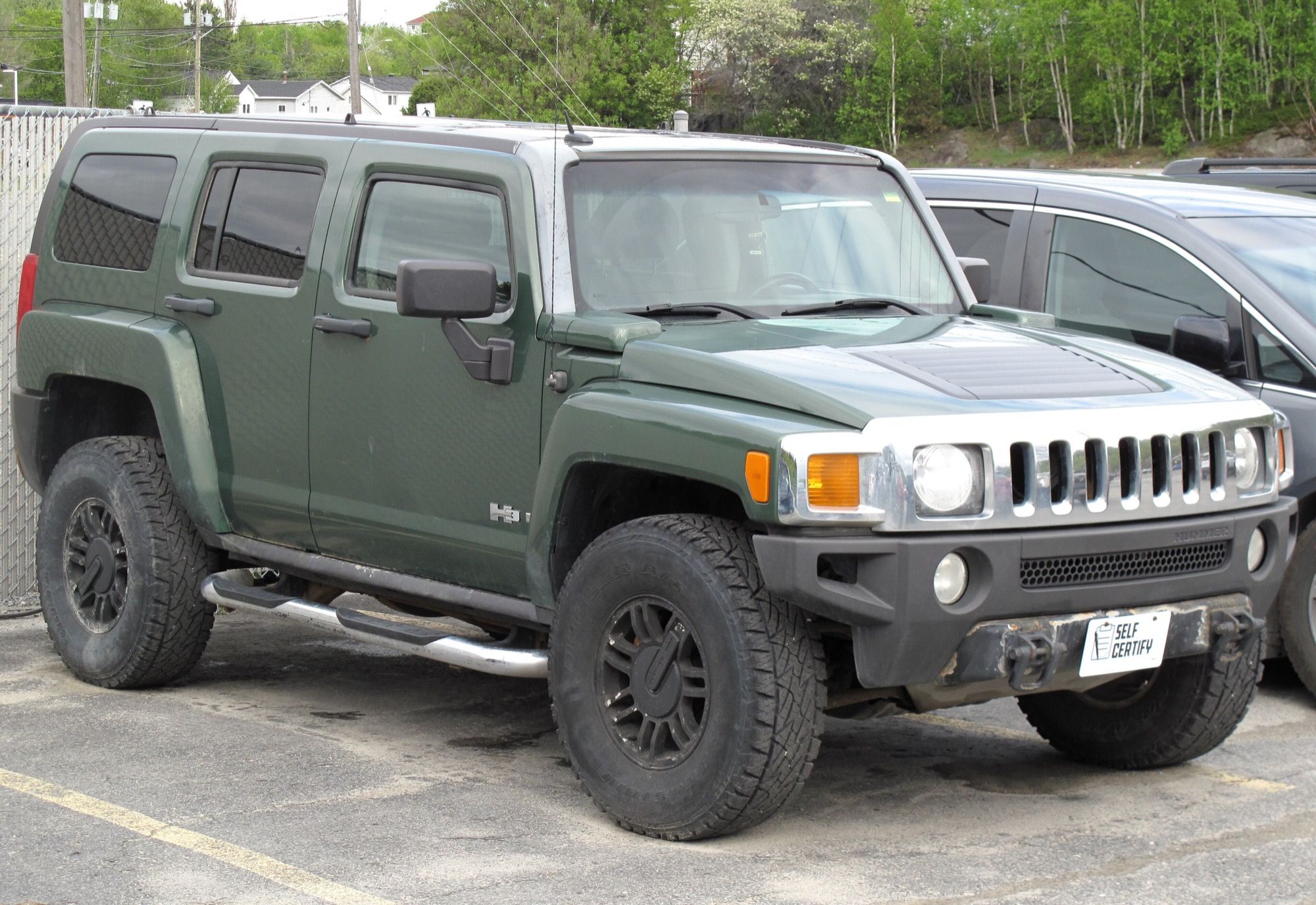 2006 Hummer H3 in Shadow Green Metallic, front-right view