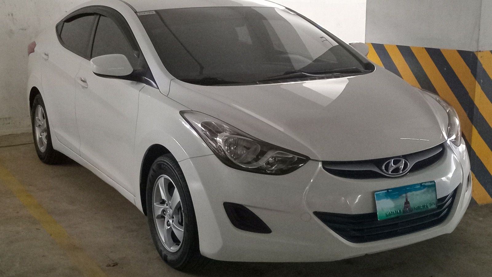 2012 Hyundai Elantra — 1.6 GL in Ceramic White, front three-quarter view