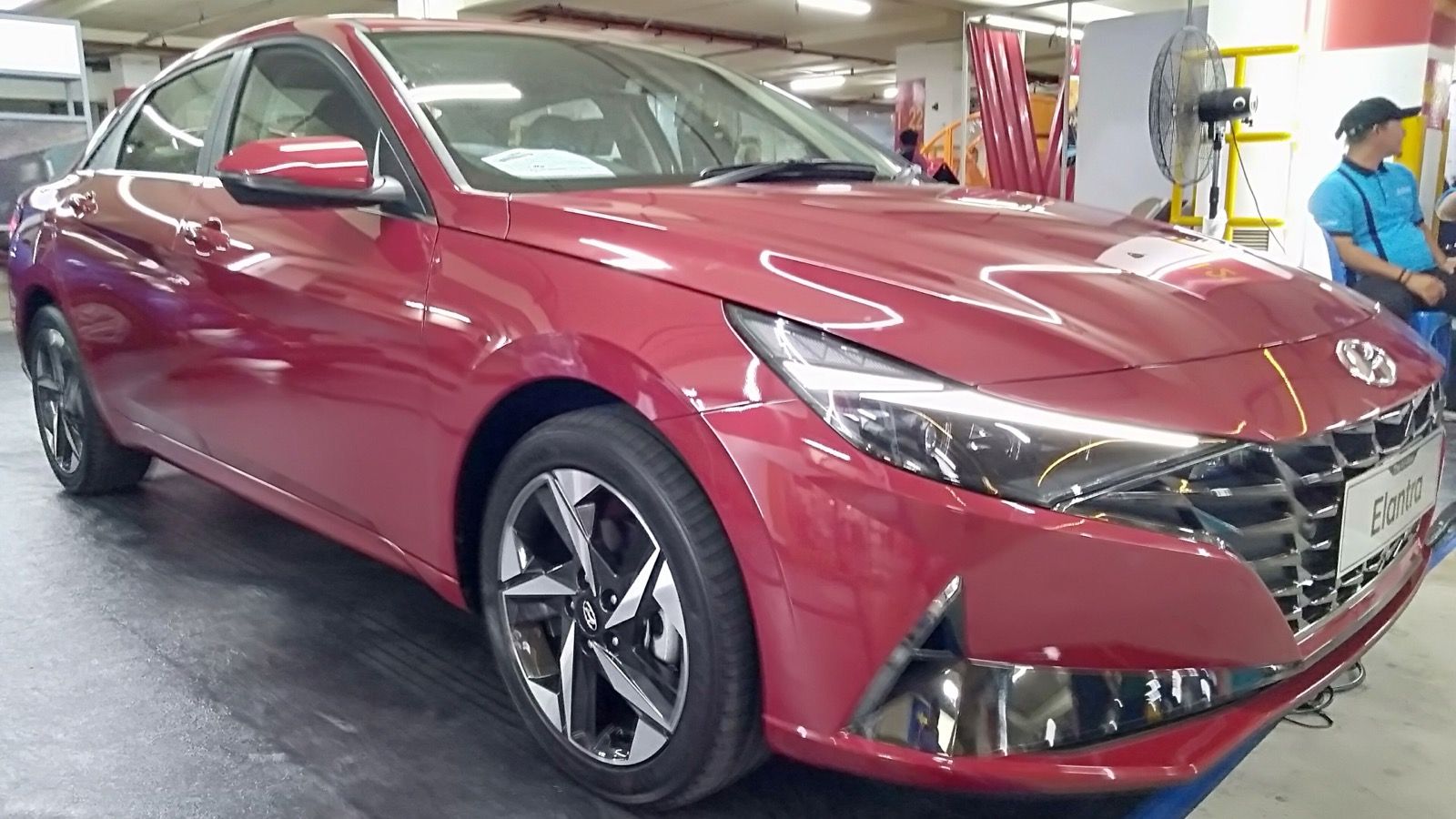 2021 Hyundai Elantra (CN7) — 1.6AT High Spec in red, front three-quarter view