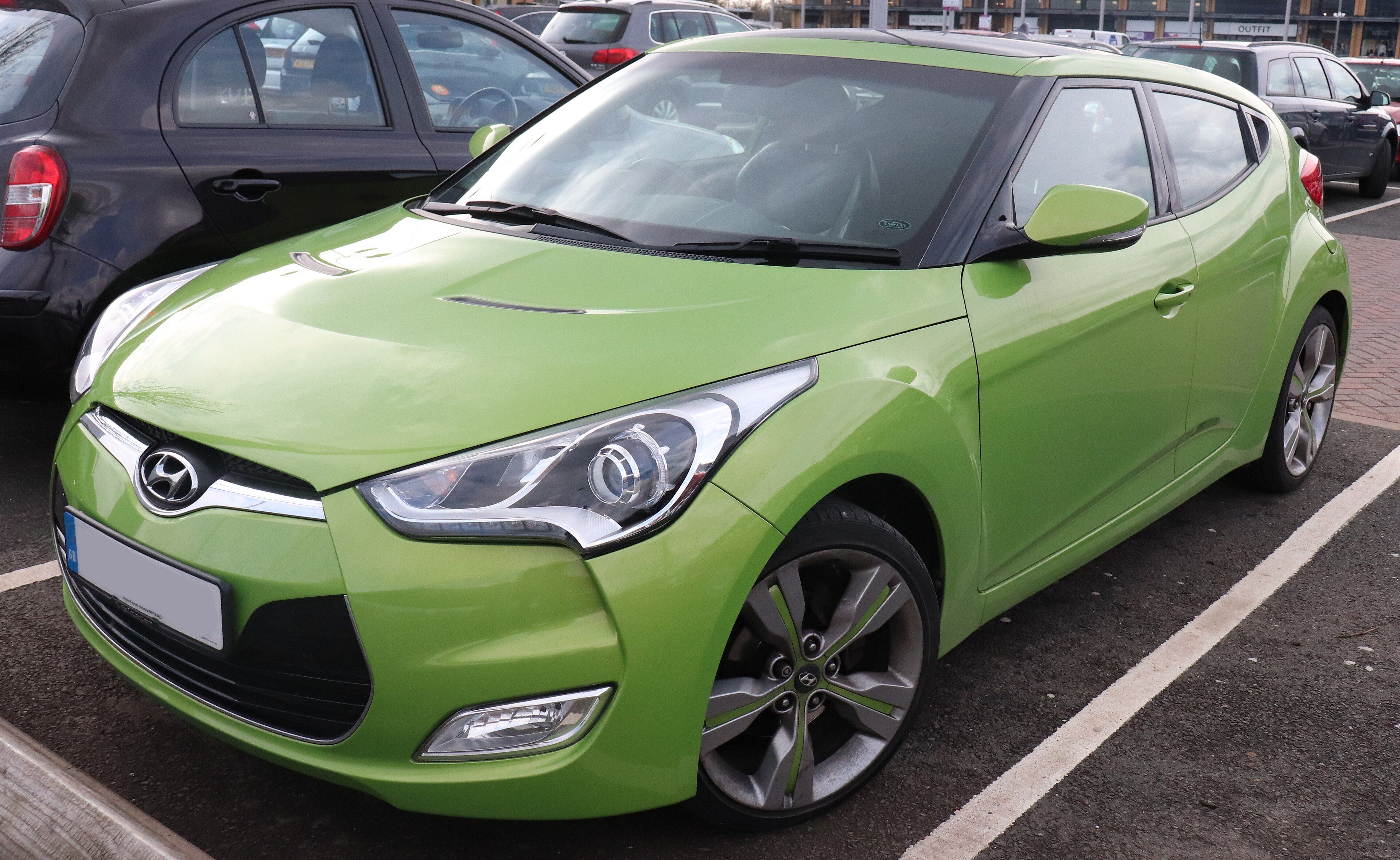 Green 2013 Hyundai Veloster Sport GDi hatchback, front three-quarter view