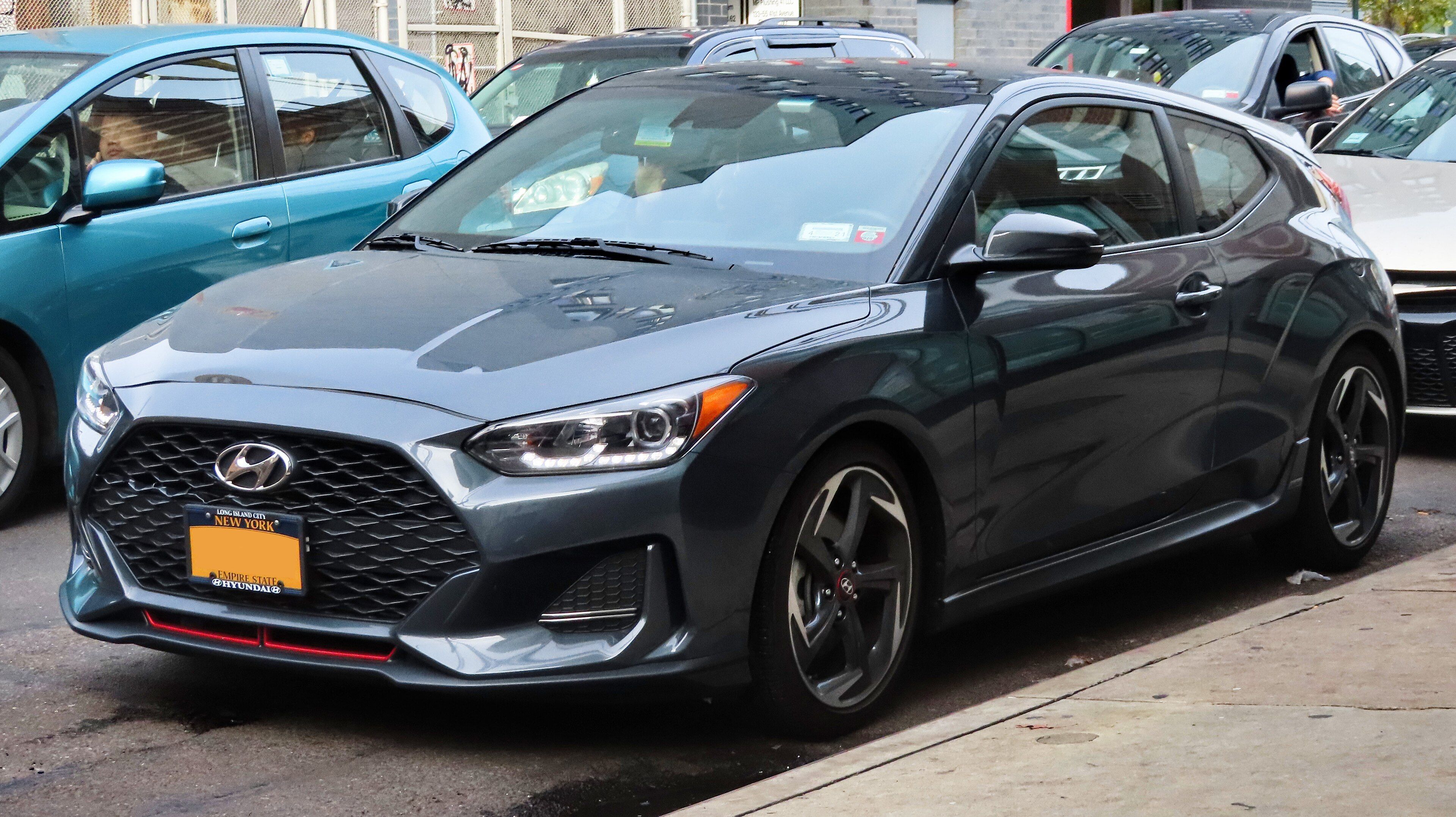 Grey 2019 Hyundai Veloster 1.6T hatchback, front three-quarter view
