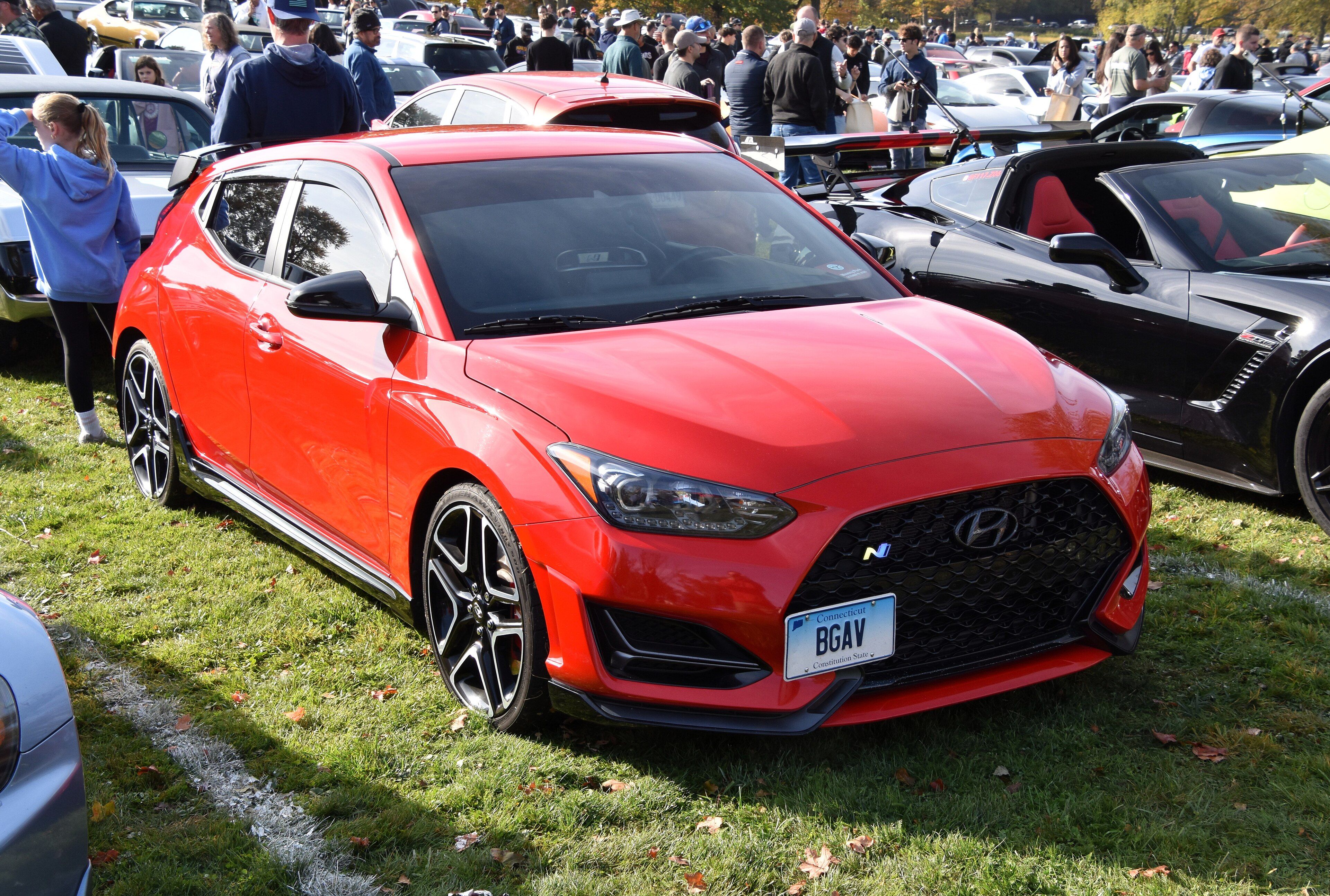 Red Hyundai Veloster N three-door hatchback, front three-quarter view