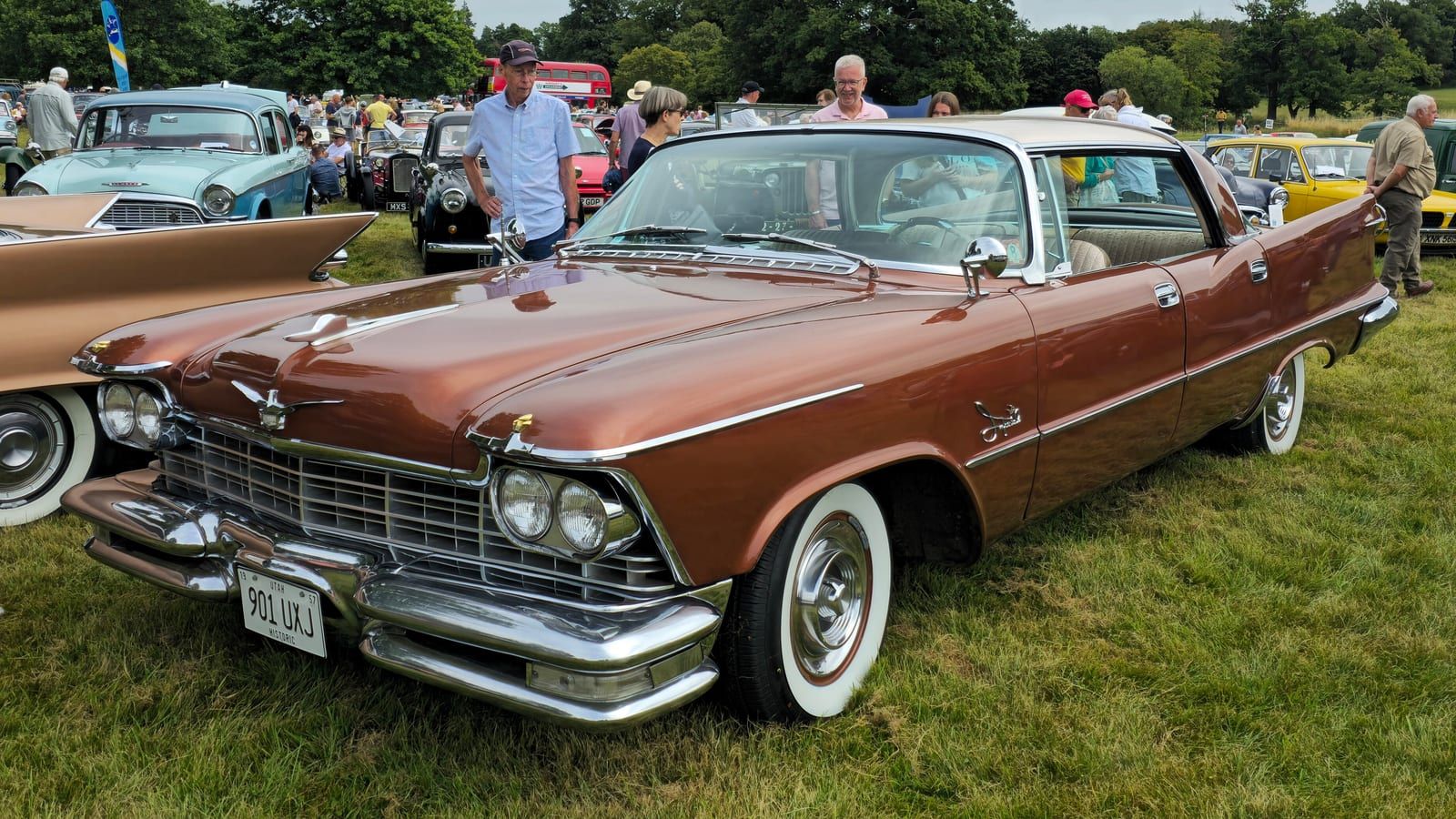 Copper 1957 Imperial Crown hardtop at a car show, front three-quarter view.