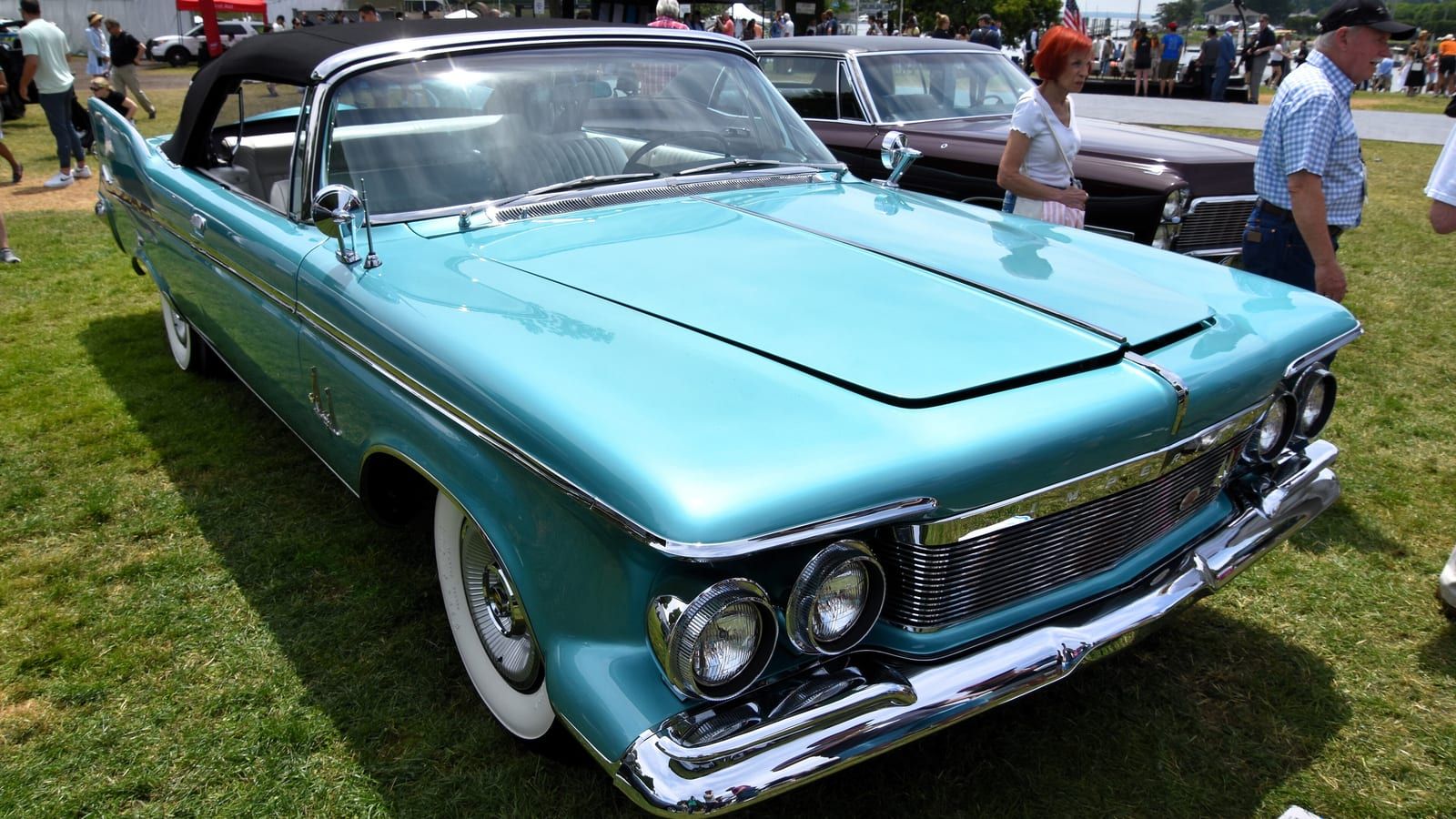 Turquoise 1961 Imperial Crown convertible, front three-quarter view.