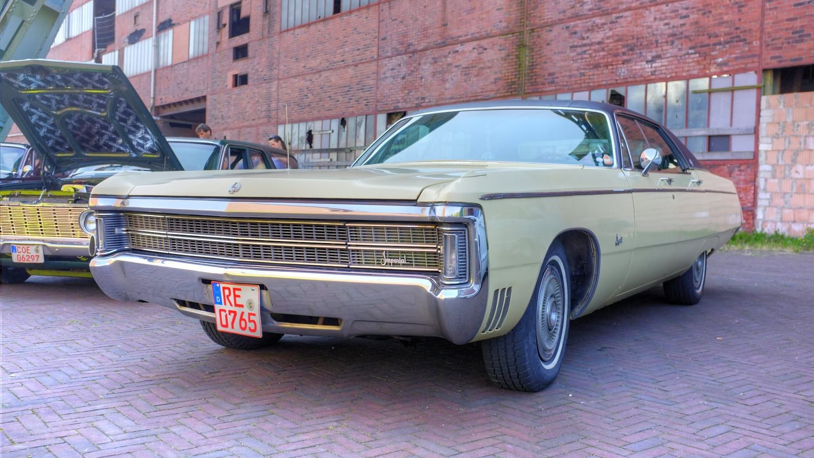 Cream 1969 Imperial with fuselage styling, front three-quarter view.