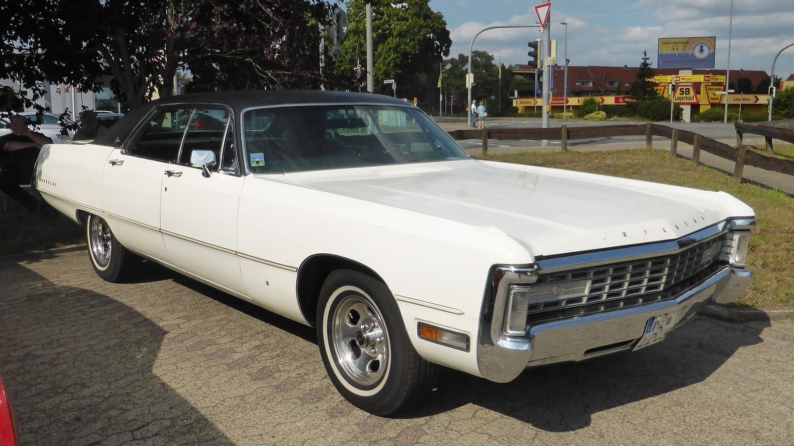 White 1971 Imperial four-door hardtop, front three-quarter view.