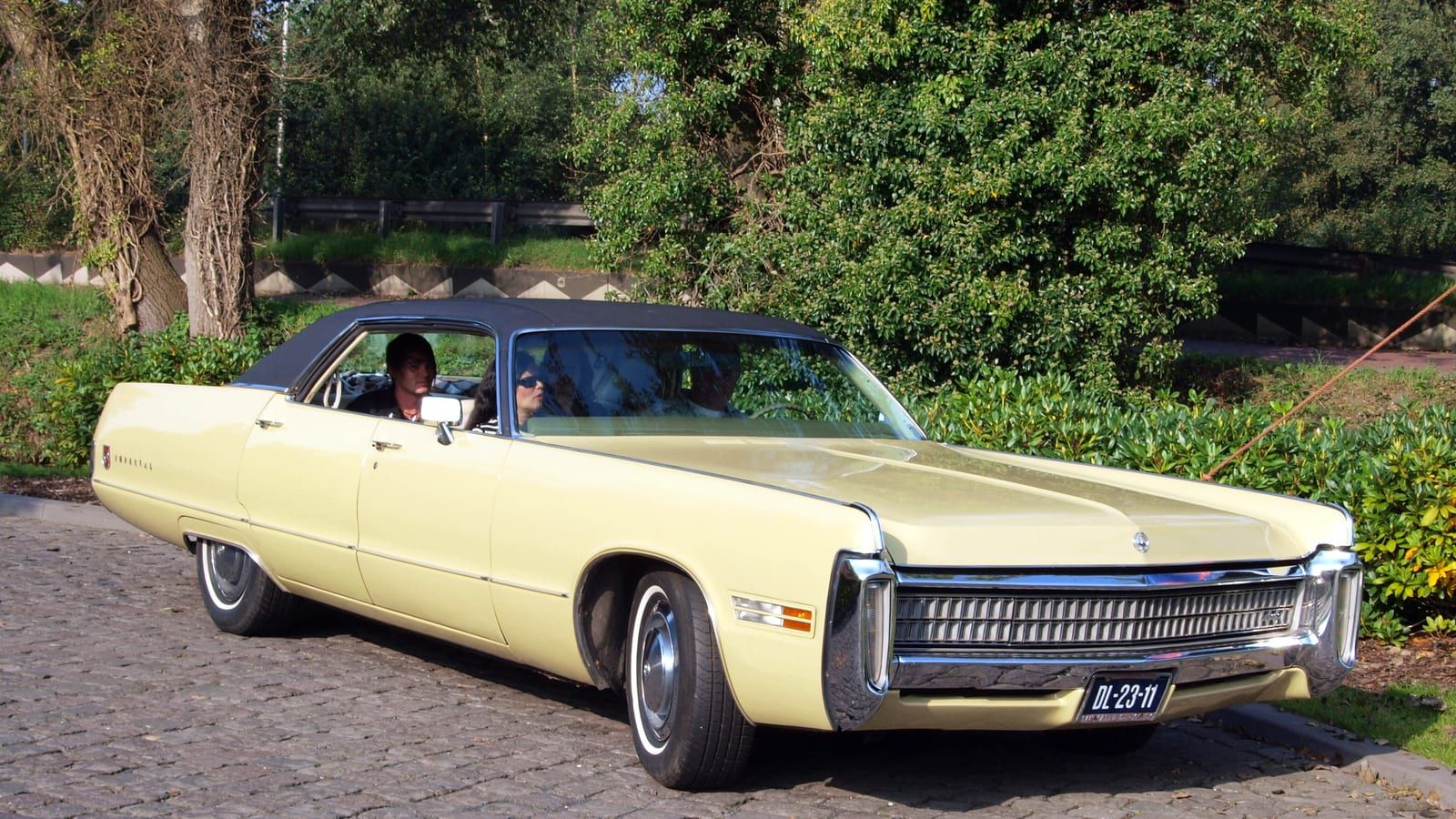 Yellow 1972 Imperial LeBaron four-door hardtop, front three-quarter view.