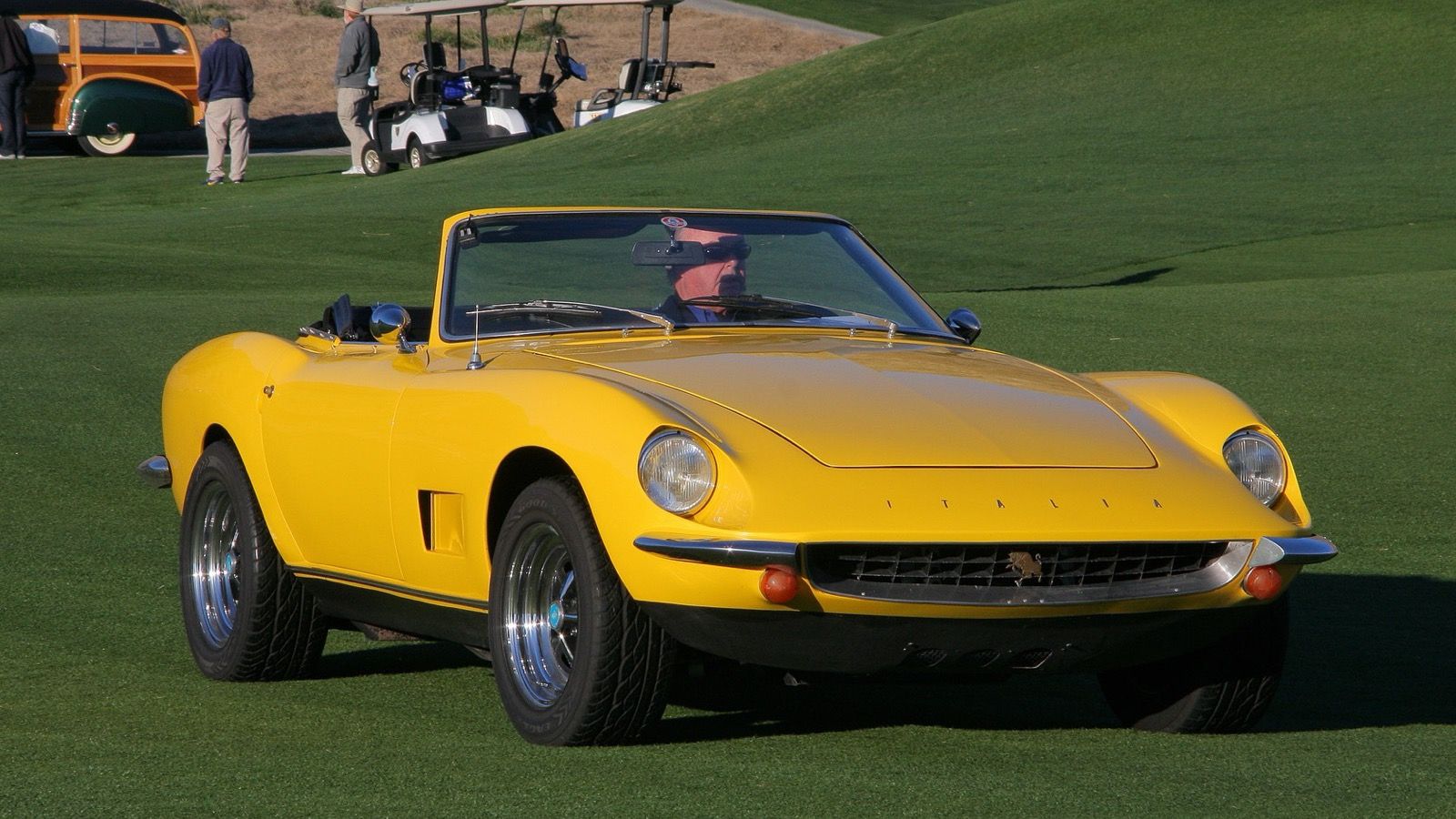 1967 Intermeccanica Italia Spyder in yellow, front three-quarter view