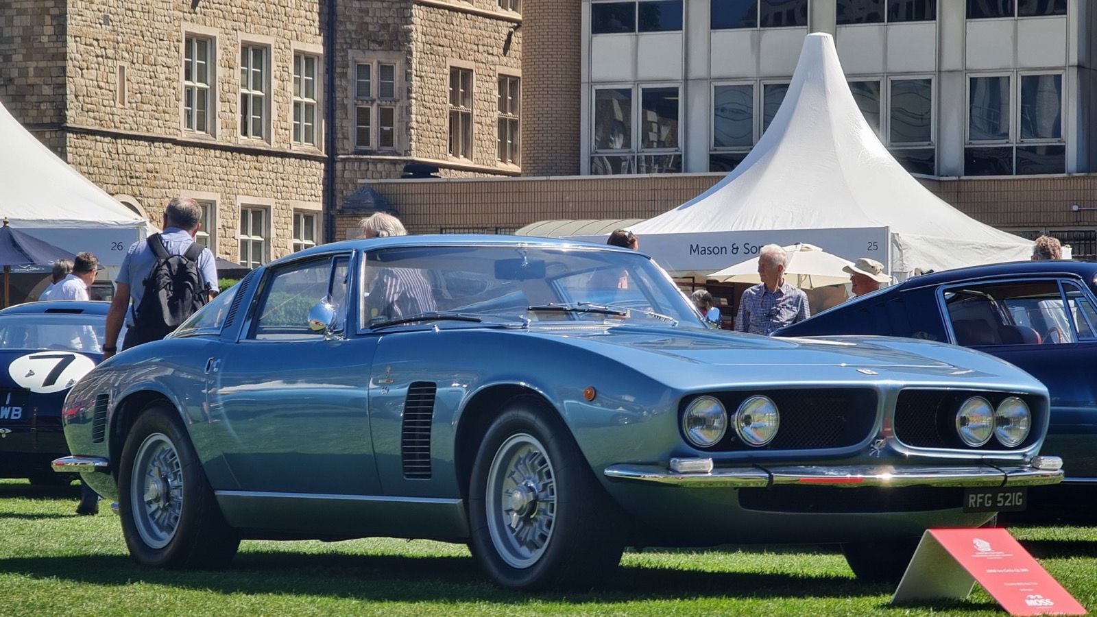 Light-blue 1968 Iso Grifo GL 365 coupe on grass, front three-quarter view