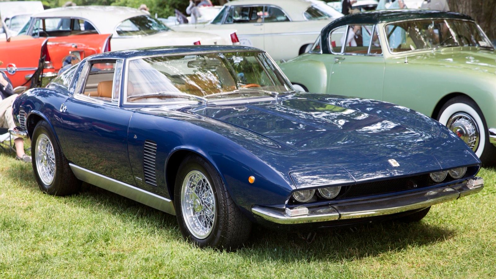 Dark-blue Iso Grifo Series II coupe with hide-away headlights, front three-quarter view