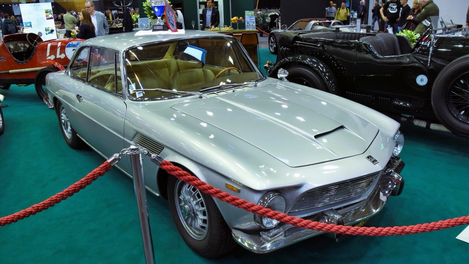 Silver 1966 Iso Rivolta IR 300 coupe on indoor display, front three-quarter view