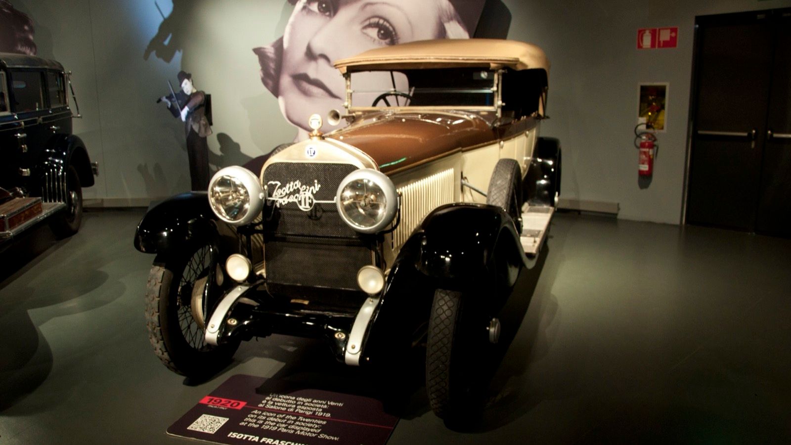 Cream and black 1920 Isotta Fraschini Tipo 8 open tourer on museum display, front three-quarter view