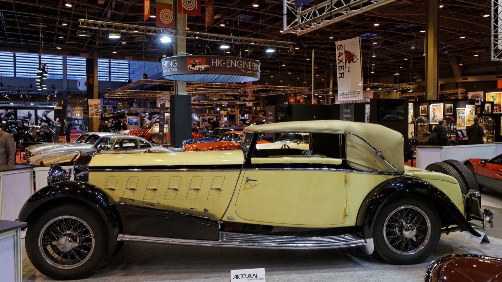 Yellow and black 1924 Isotta Fraschini Tipo 8A cabriolet by Ramseier at Retromobile, side profile