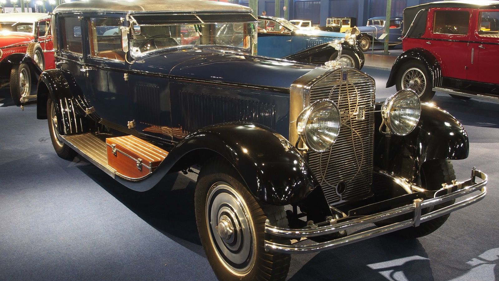 Dark blue 1928 Isotta Fraschini Tipo 8A landaulet on museum display, front three-quarter view