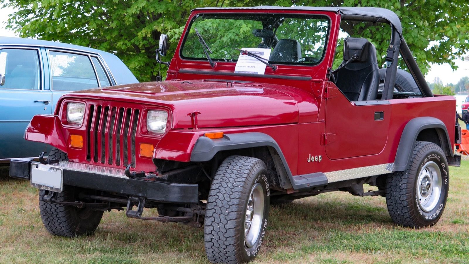 1987 Jeep Wrangler YJ in red, front three-quarter view (square headlamps)