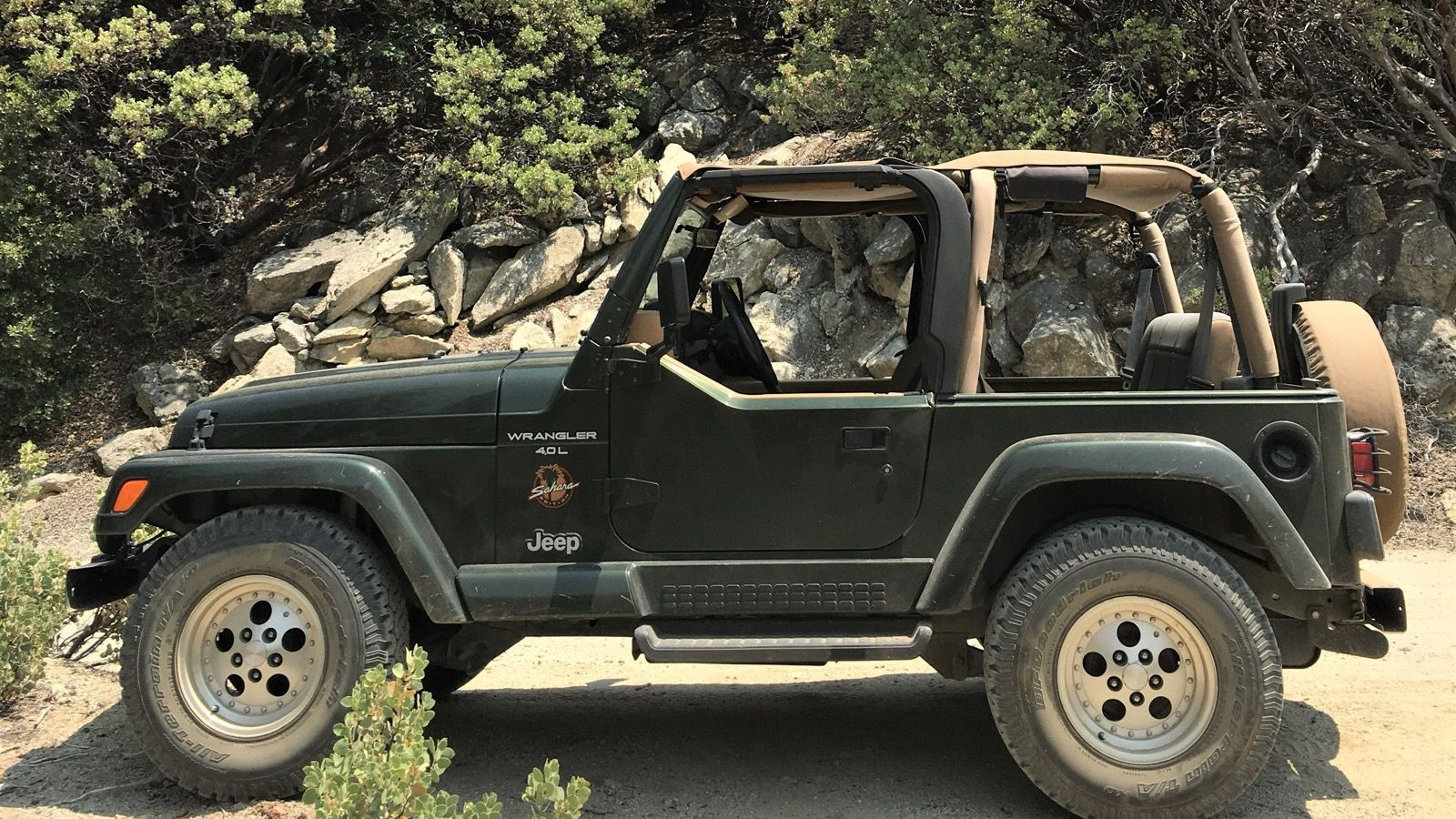 1998 Jeep Wrangler TJ Sahara with soft top, front three-quarter view