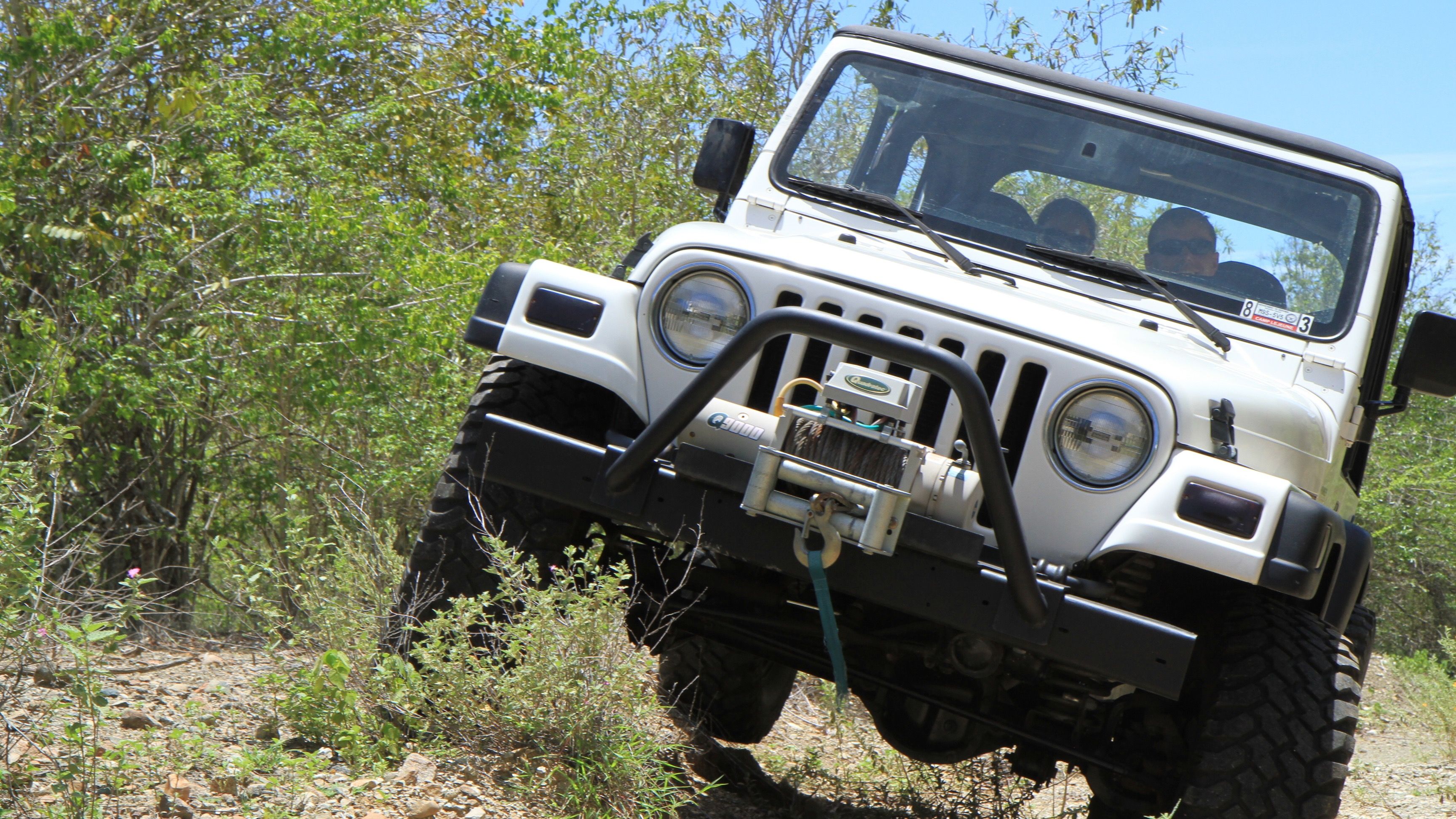 2000 Jeep Wrangler TJ driving off-road, front view