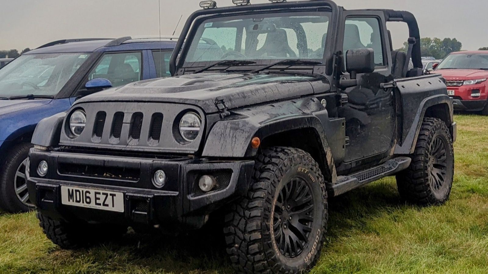 2016 Jeep Wrangler JK Sahara, front three-quarter view