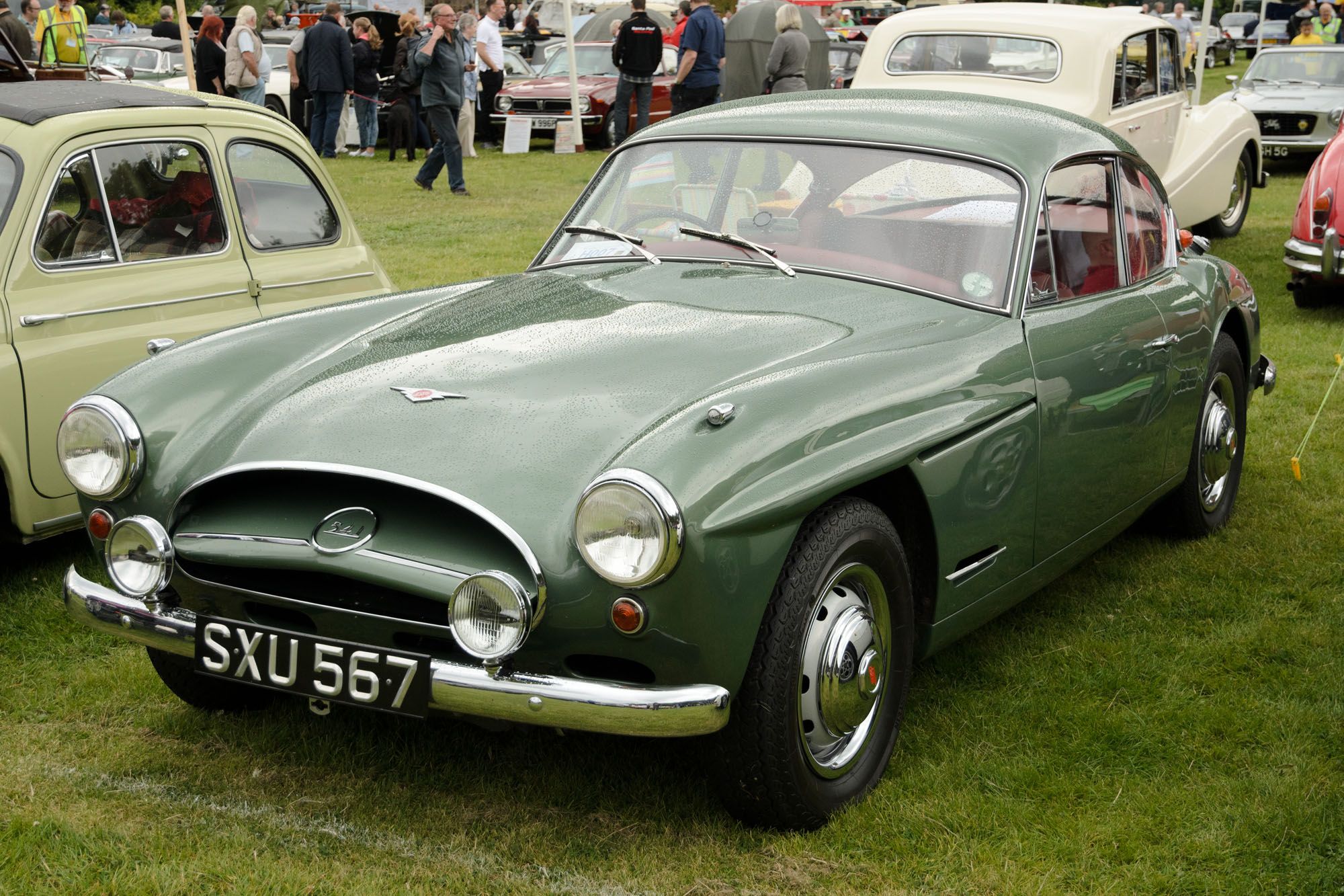 Light green 1956 Jensen 541 coupé on grass, front three-quarter view