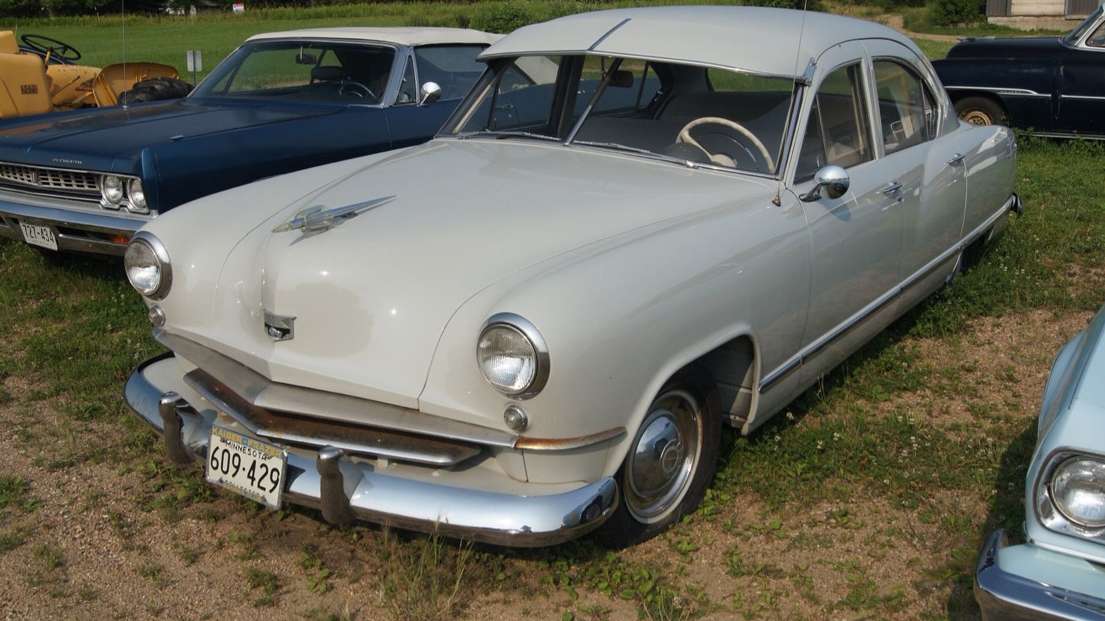 White 1951 Kaiser sedan with the 'Anatomic Design' body, front three-quarter view