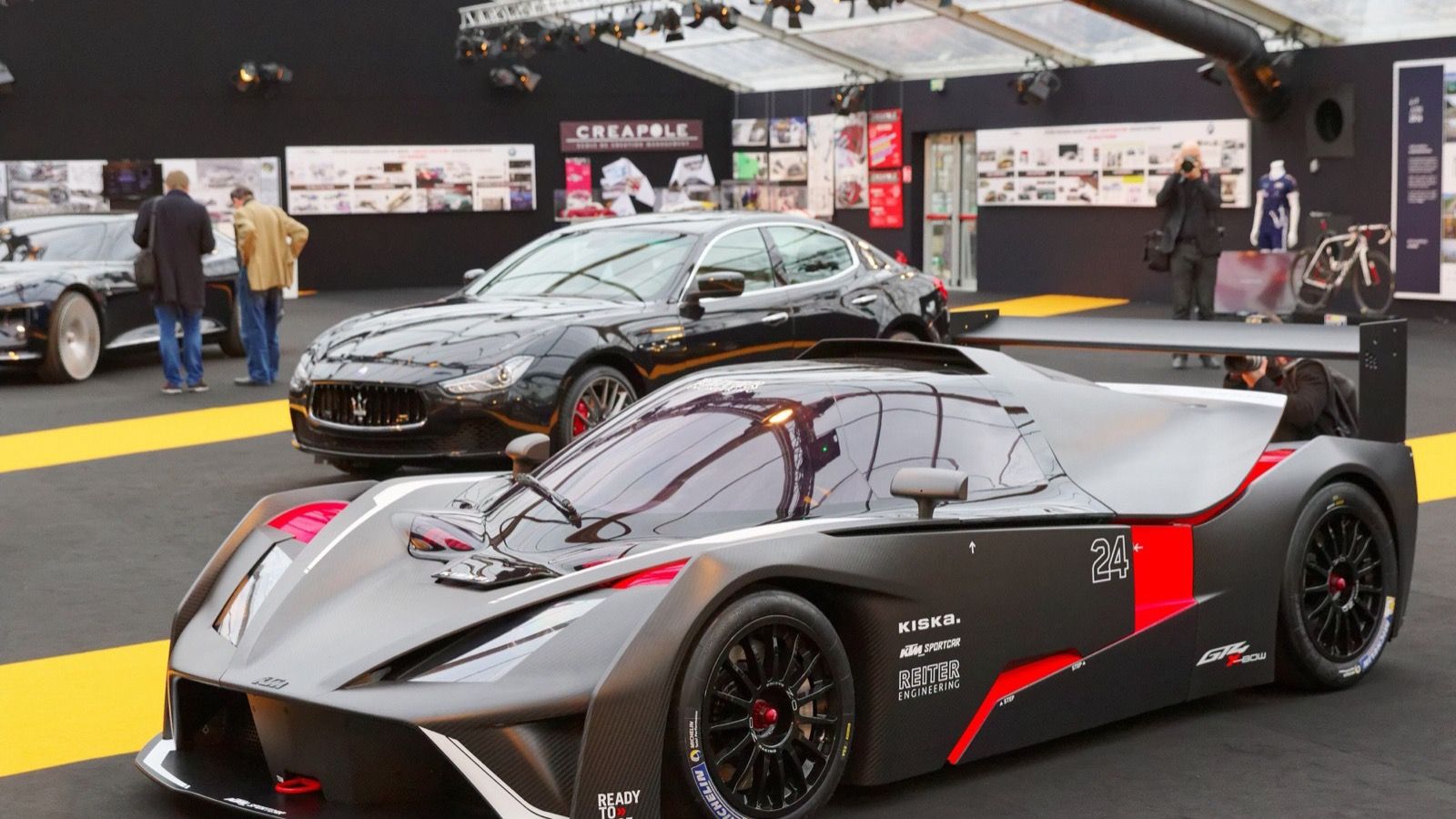Carbon and red KTM X-Bow GT4 race car at the 2016 Festival Automobile International, front three-quarter view