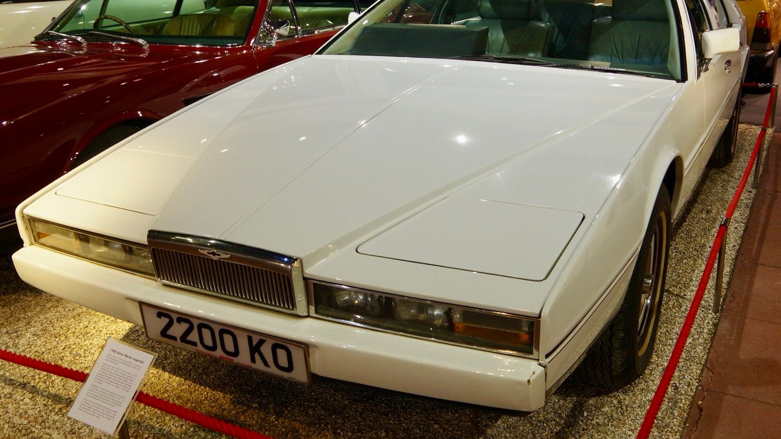 White 1982 Aston Martin Lagonda wedge saloon on museum display, front three-quarter view