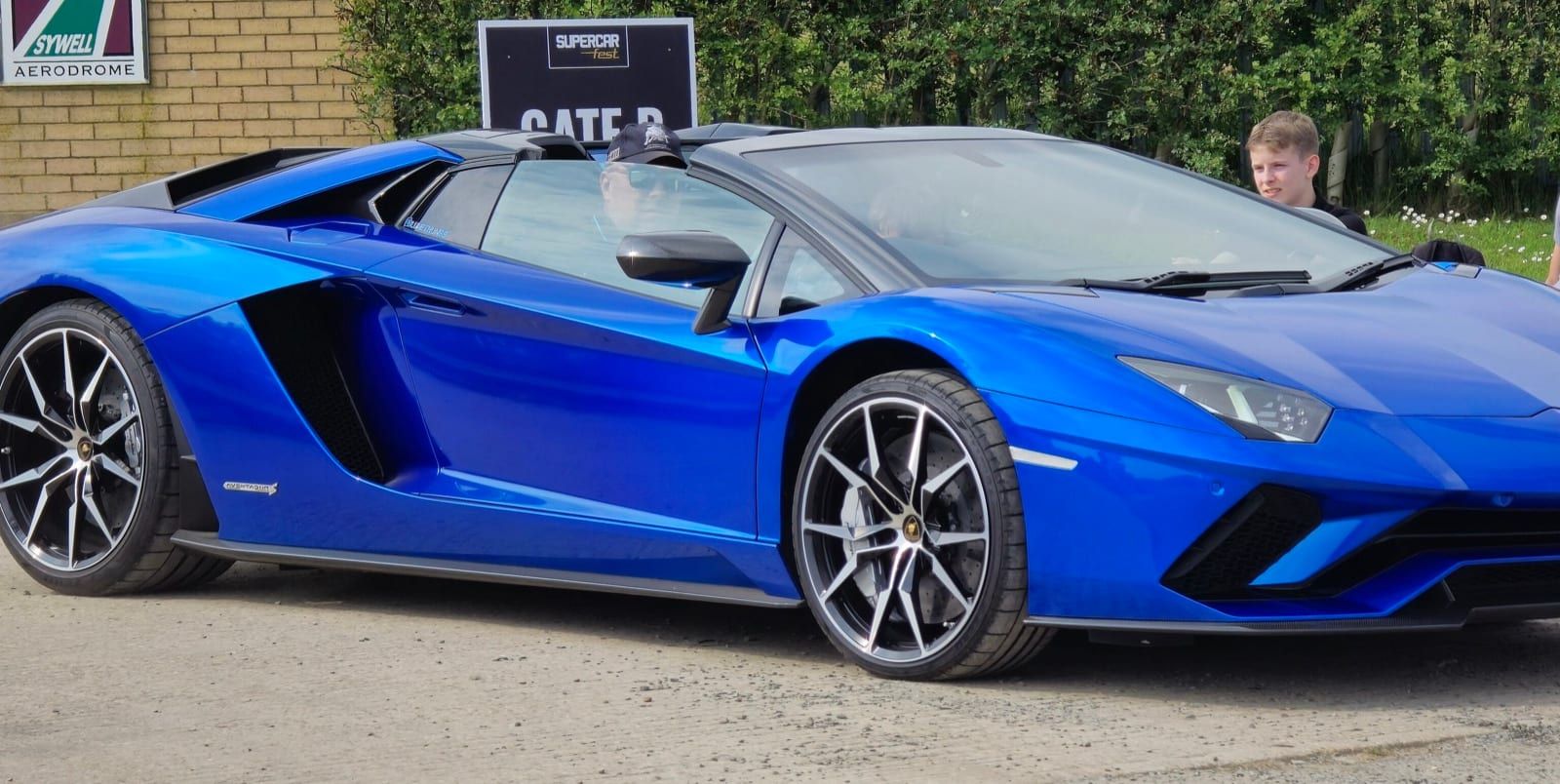 Blue 2018 Lamborghini Aventador S Roadster, front three-quarter view