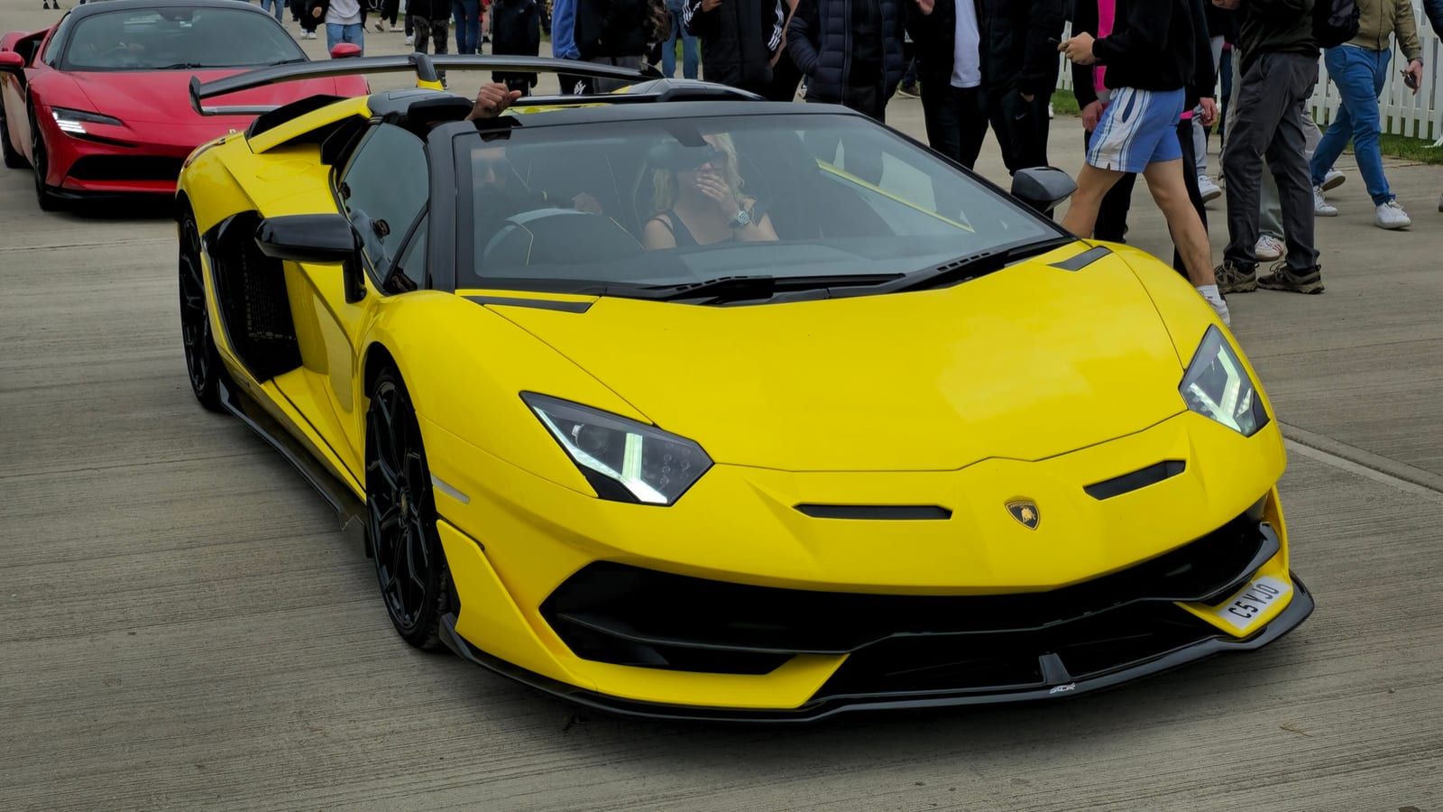 Yellow 2020 Lamborghini Aventador SVJ Roadster, front three-quarter view