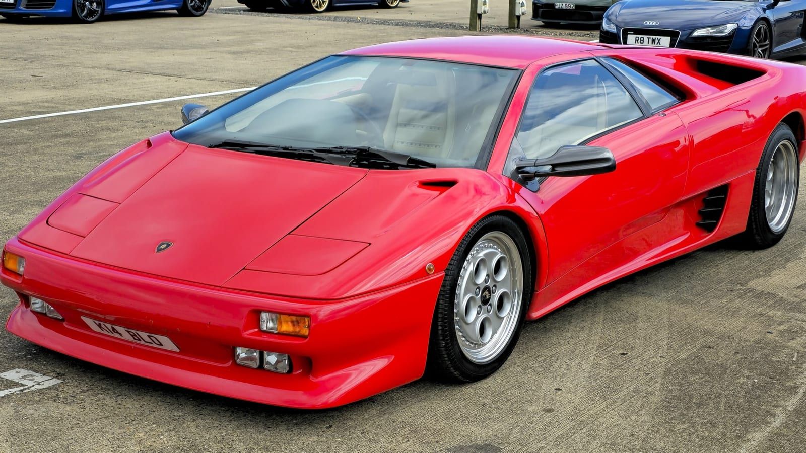 Red 1993 Lamborghini Diablo, front three-quarter view