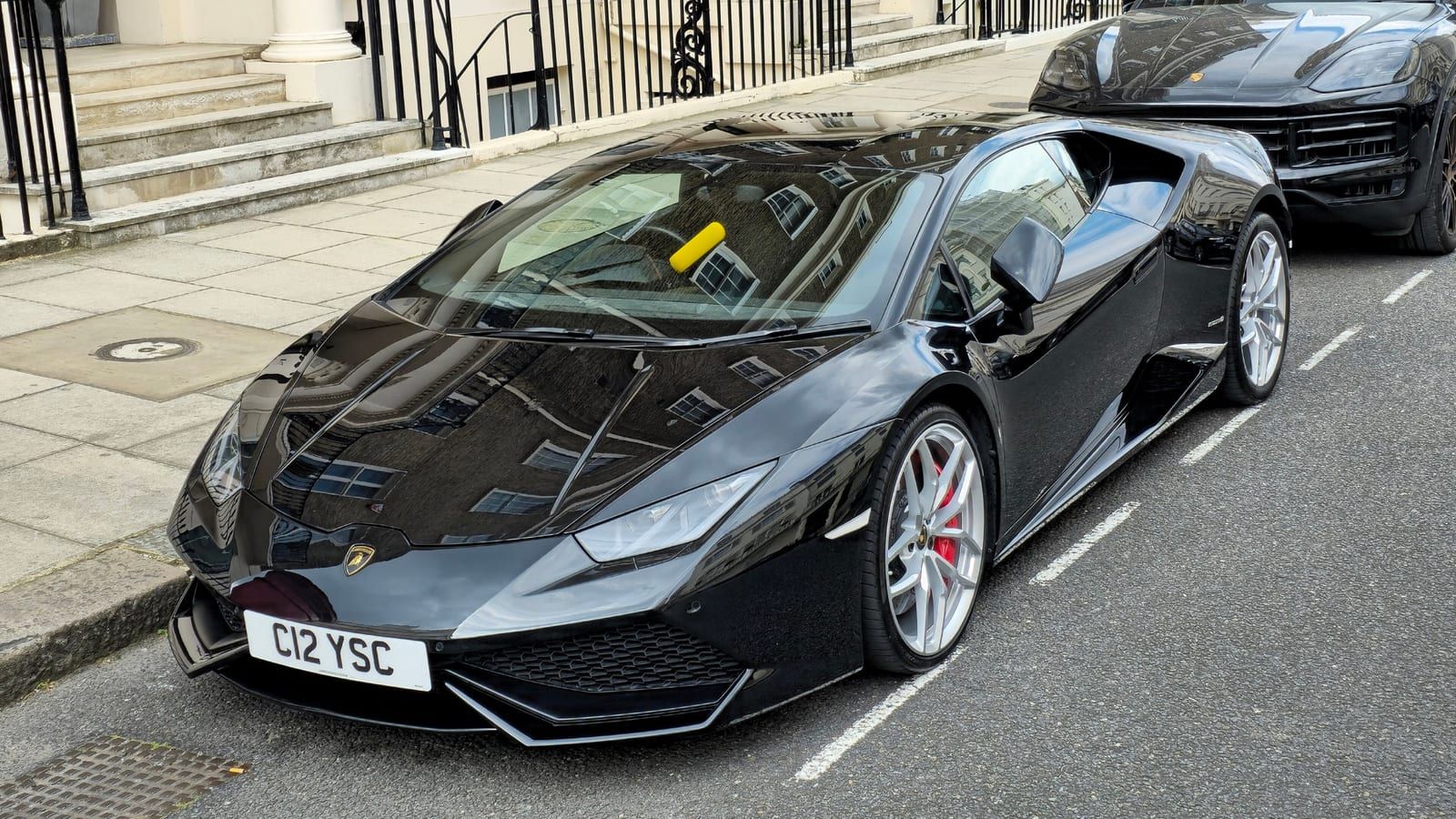 Black 2015 Lamborghini Huracan, front three-quarter view