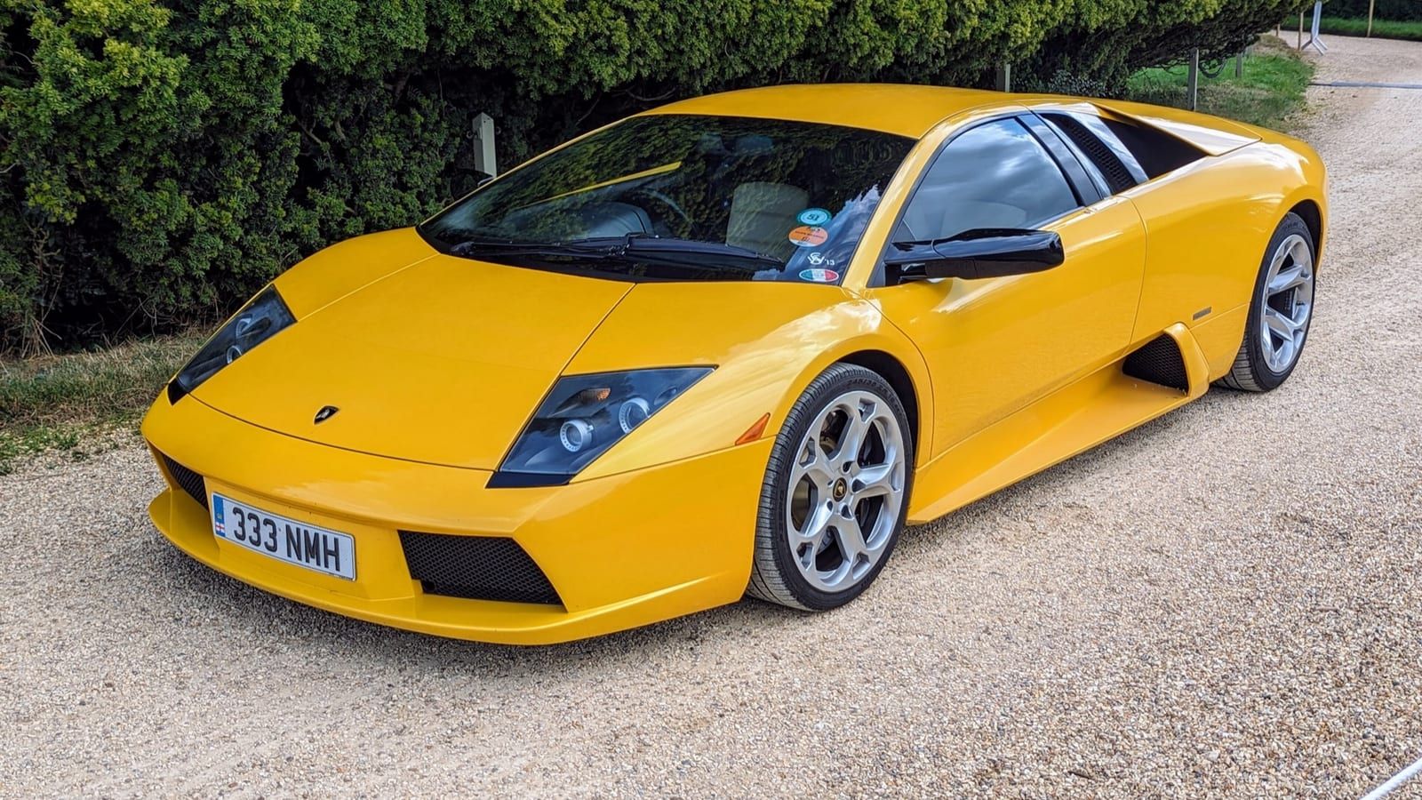 Yellow 2002 Lamborghini Murcielago coupe, front three-quarter view