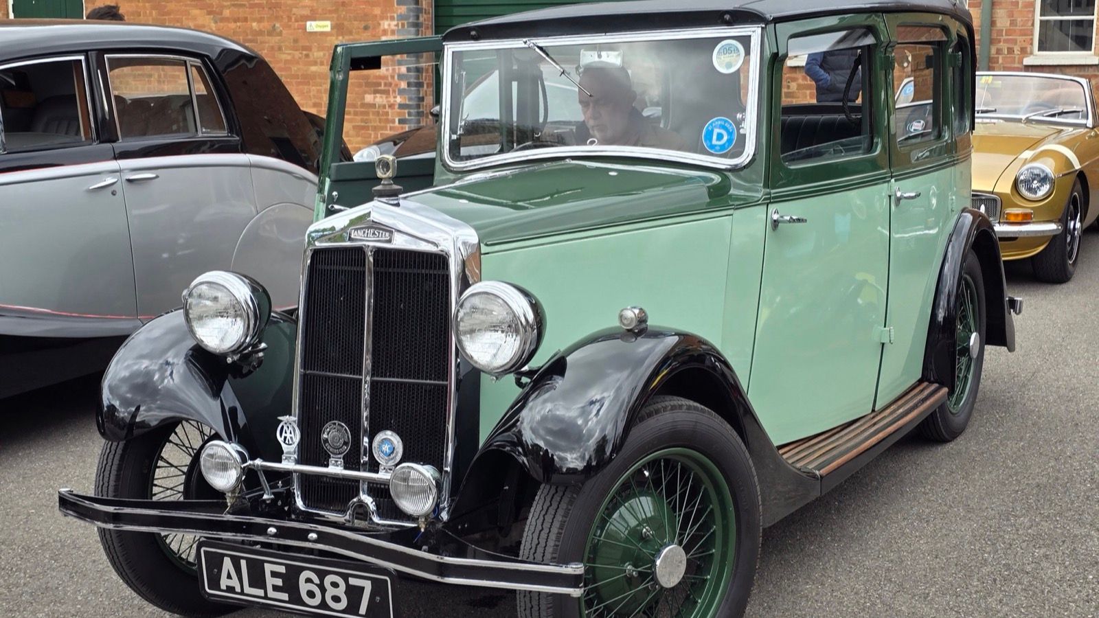Green and black 1933 Lanchester Ten saloon, front three-quarter view