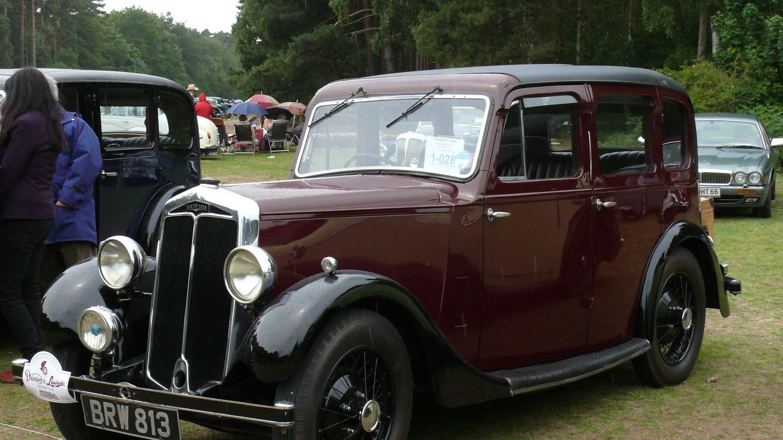 Maroon and black 1936 Lanchester Ten six-light saloon, front three-quarter view