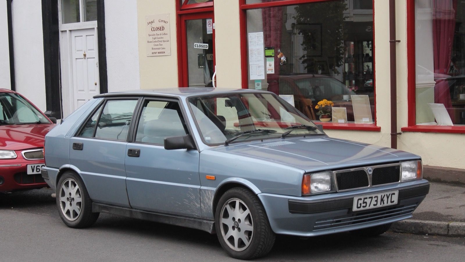 Light-blue 1989 Lancia Delta 1.3 LX five-door hatchback, front three-quarter view
