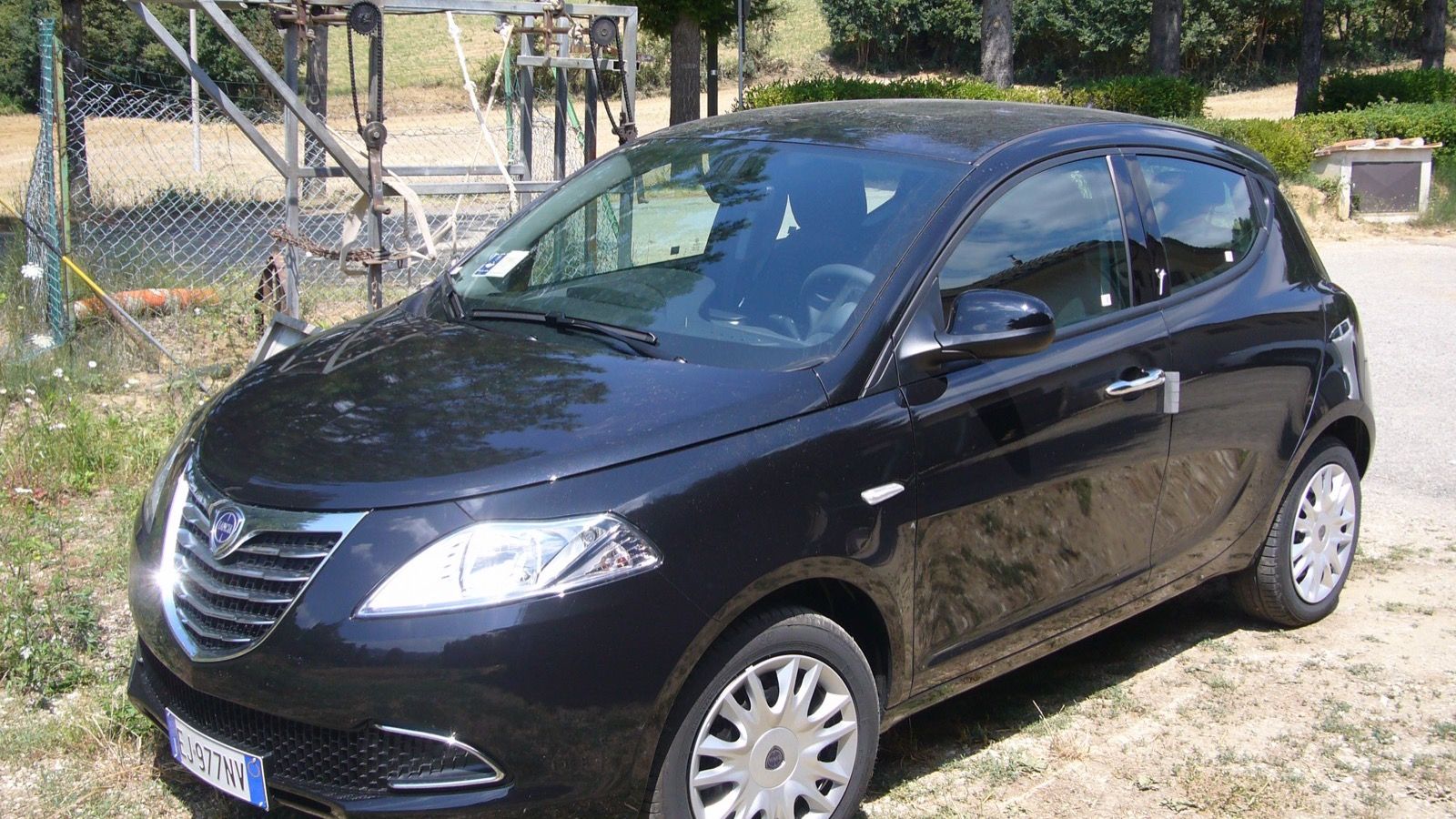 Black 2011 Lancia Ypsilon 1.2 five-door hatchback, front three-quarter view