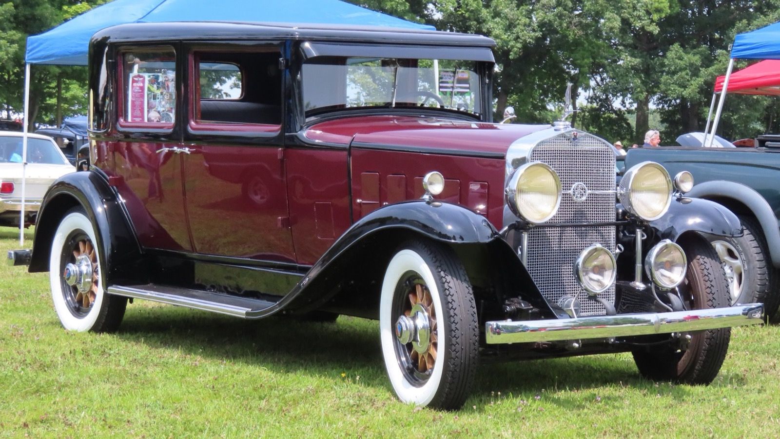 1931 LaSalle five-passenger town sedan in maroon and black, front three-quarter view