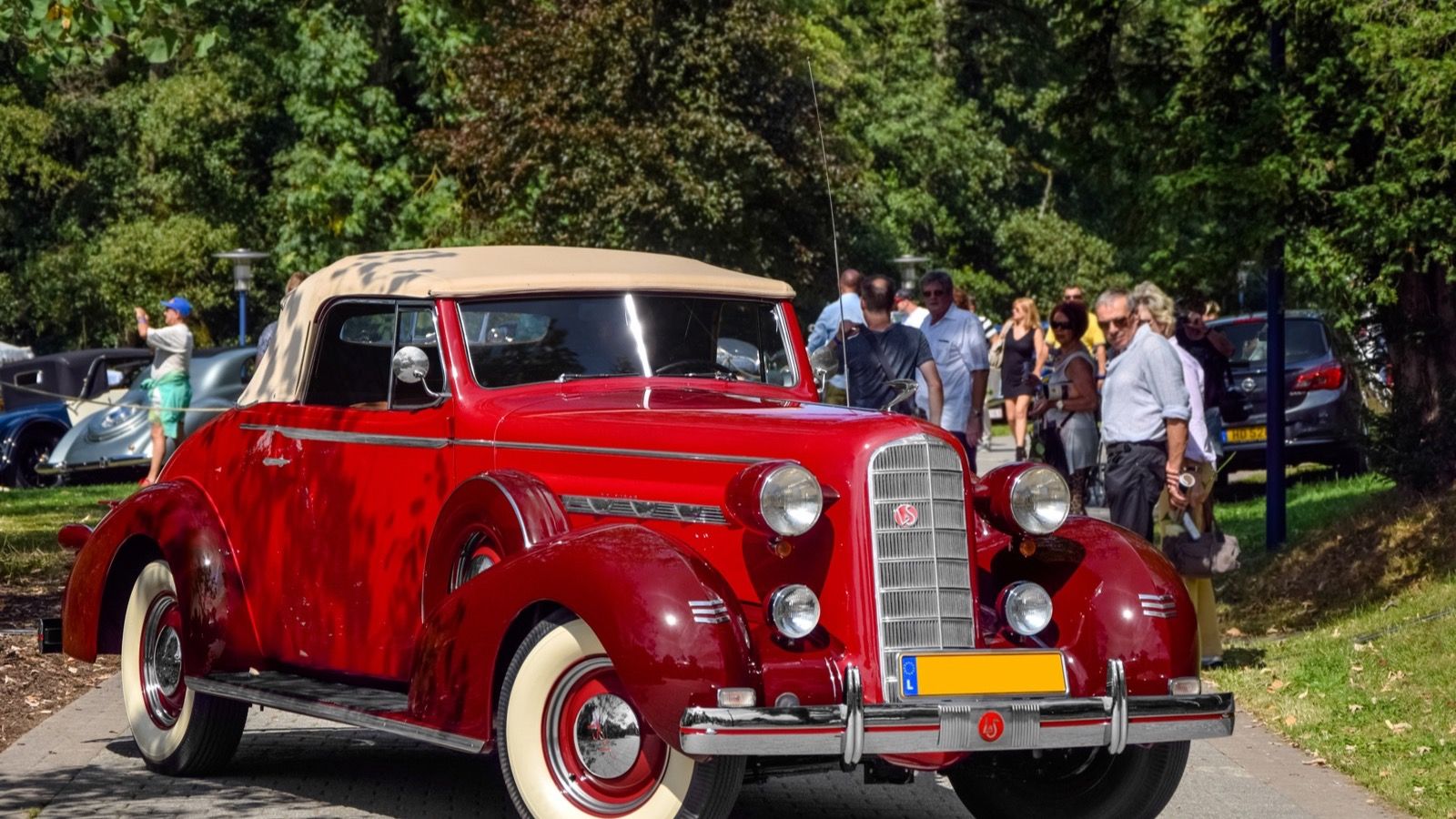 1936 LaSalle convertible coupe in red with tan top, front three-quarter view